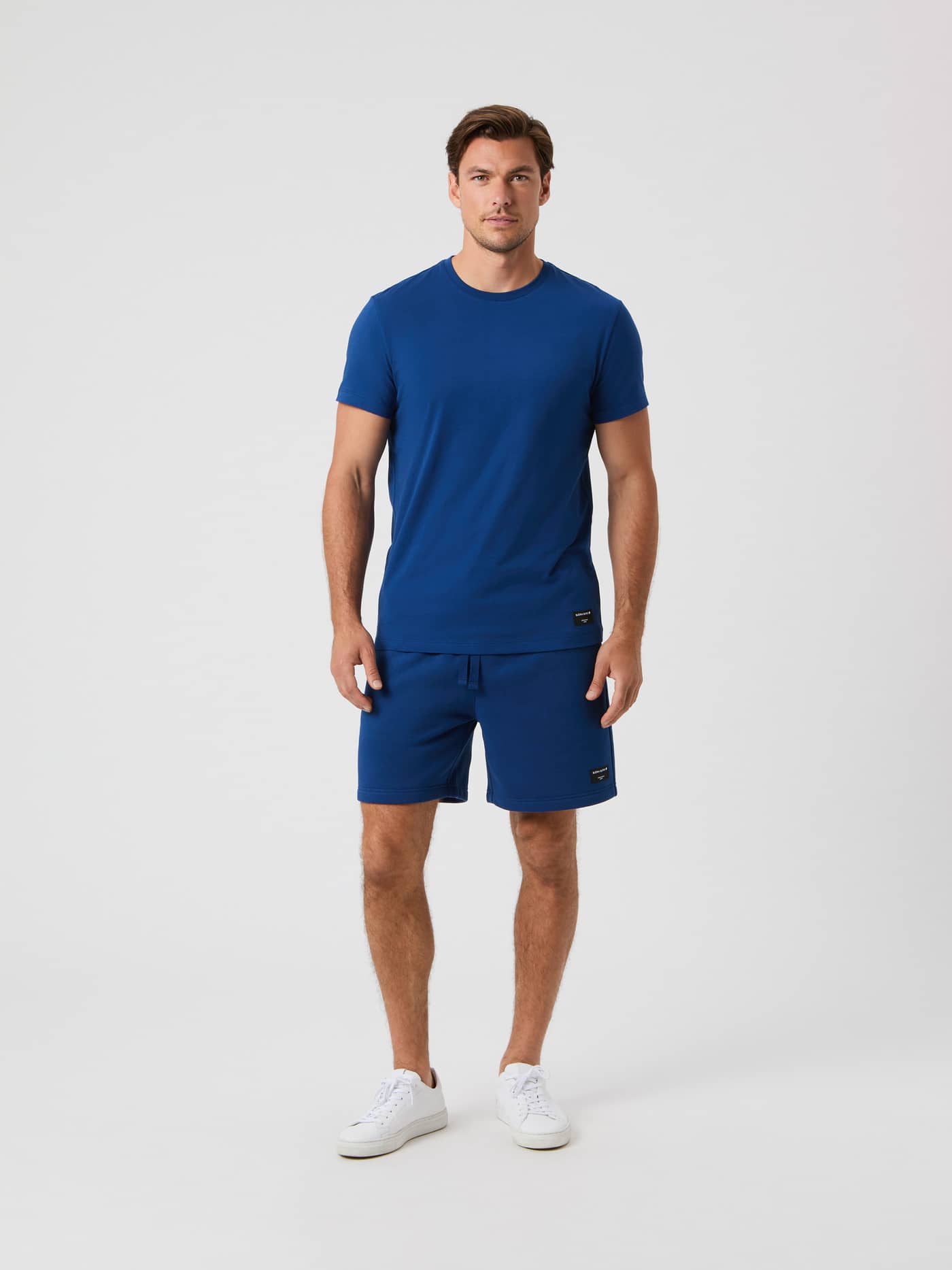 Front view of a model wearing the Björn Borg Centre T-Shirt in Estate Blue with matching shorts. - Image 3