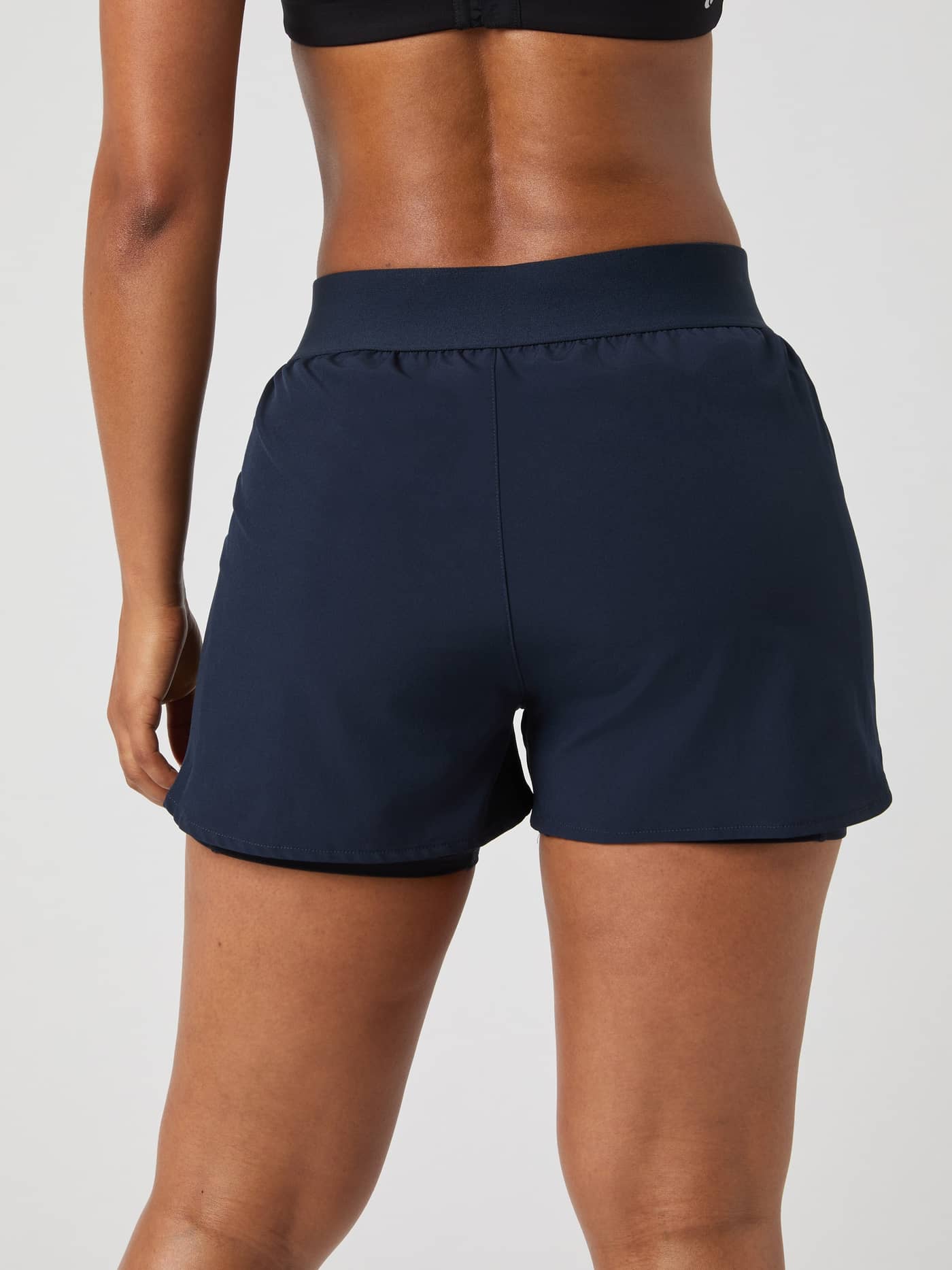 Back view of a model wearing the Björn Borg Ace 2 In 1 Shorts in the colour Night Sky. - Image 3