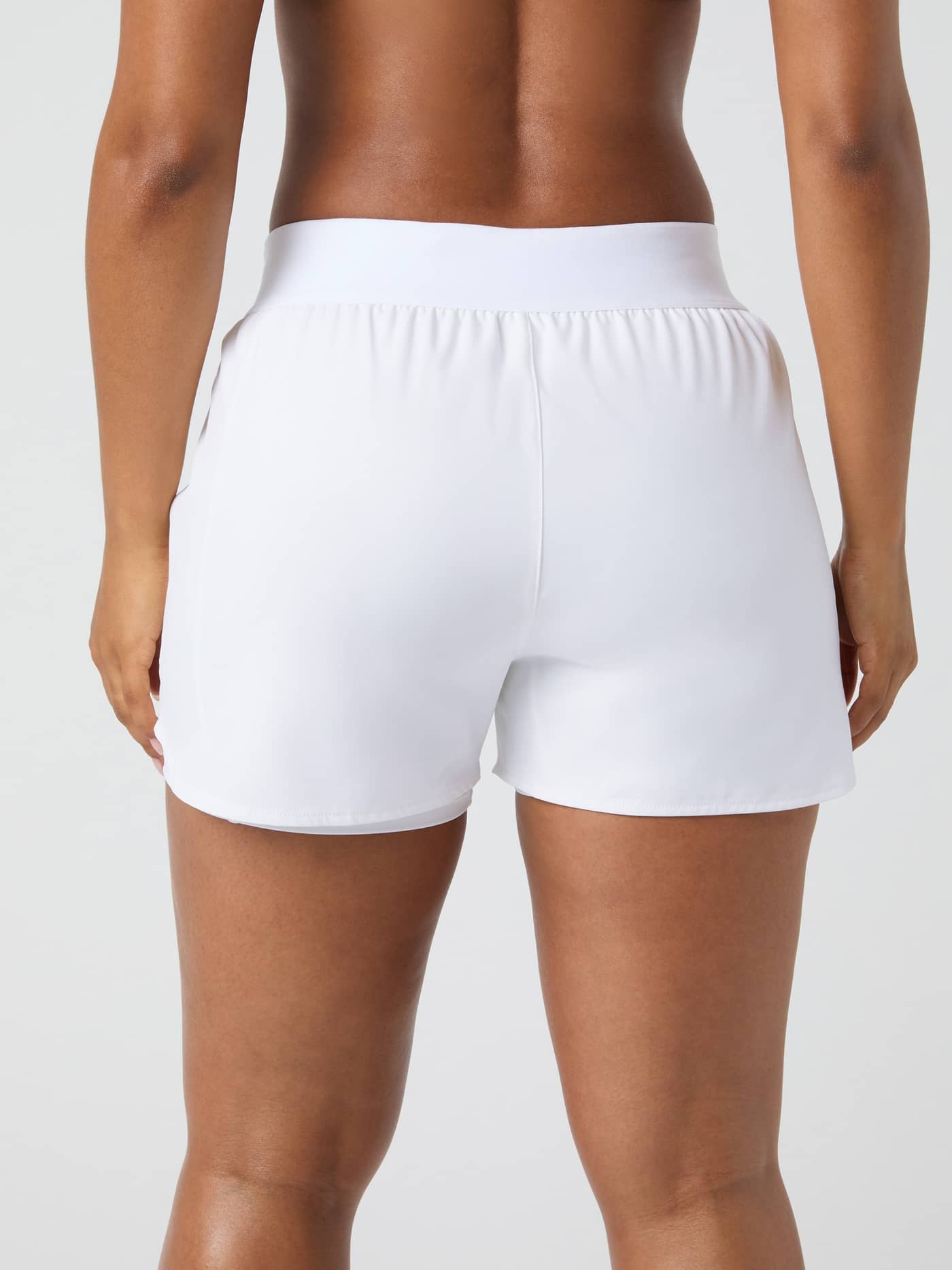 Back view of a model wearing the Björn Borg Ace 2 in 1 Shorts in Brilliant White. - Image 2