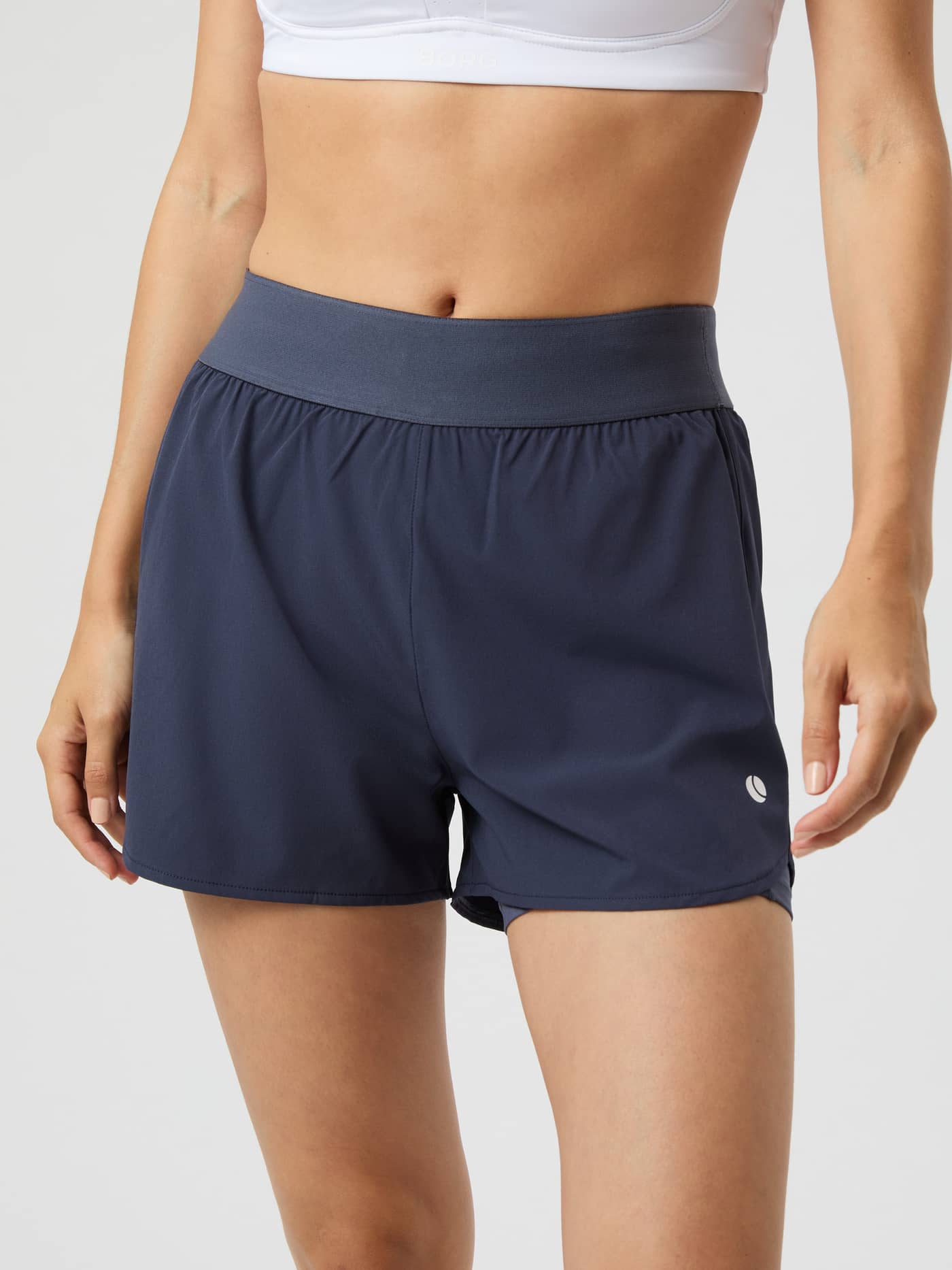 Front view of a model wearing the grey Björn Borg Ace 2 in 1 Shorts. - Image 1