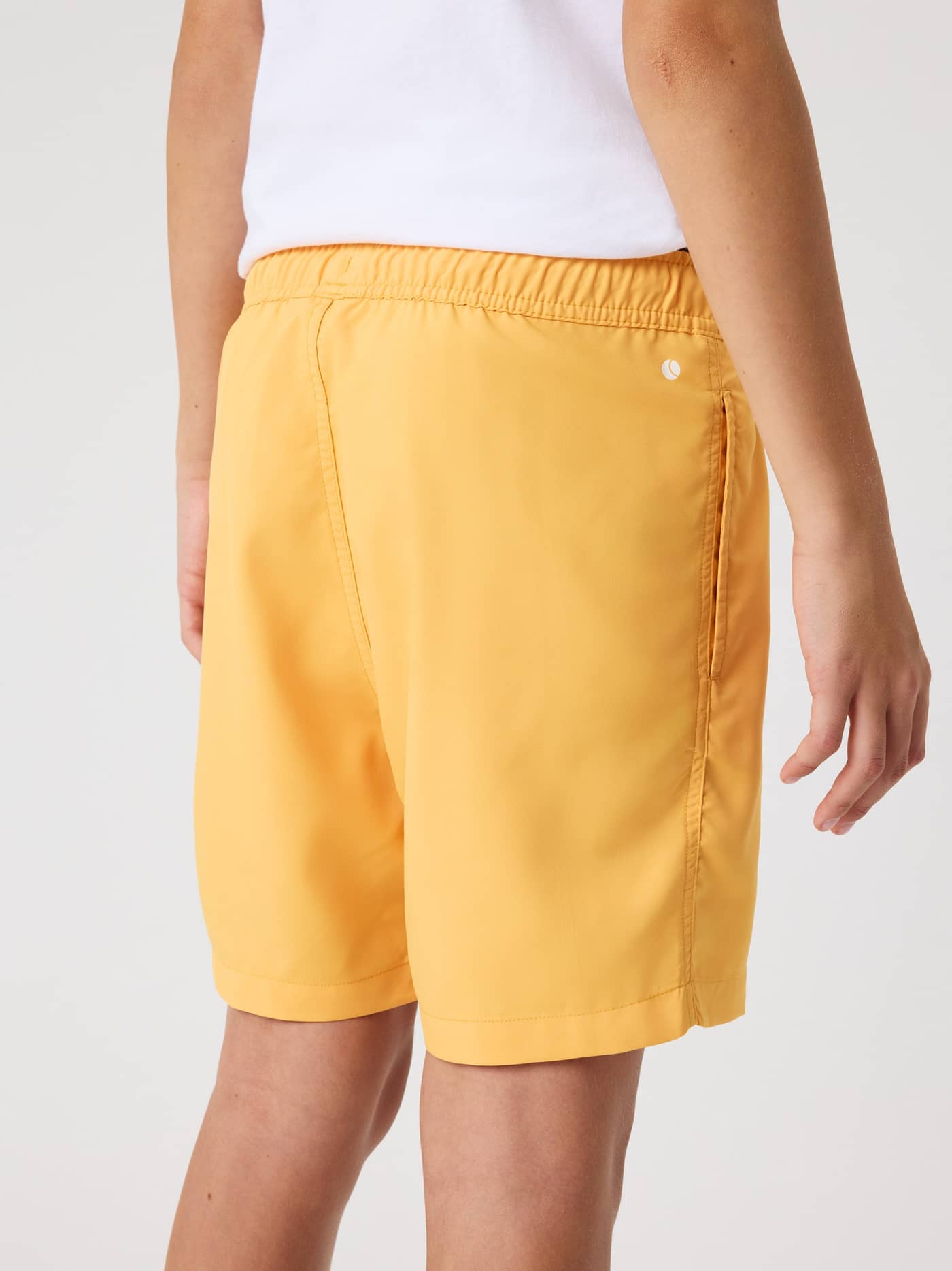 Borg Swim Shorts til børn i Marigold (Gul) set bagfra med behagelig pasform og lille hvidt logo. - Image 2