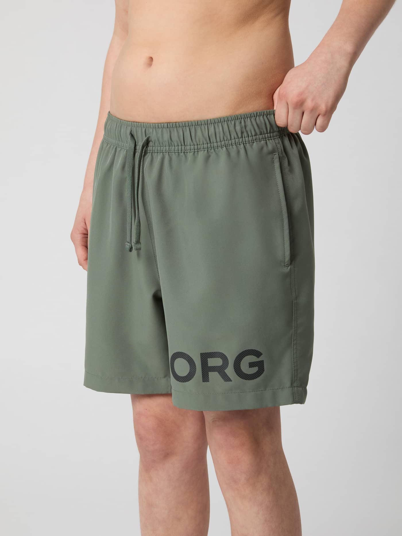 Borg Swim Shorts til børn i Agave Green (Grøn) set forfra med sort logo og justerbar snøre i taljen. - Image 2