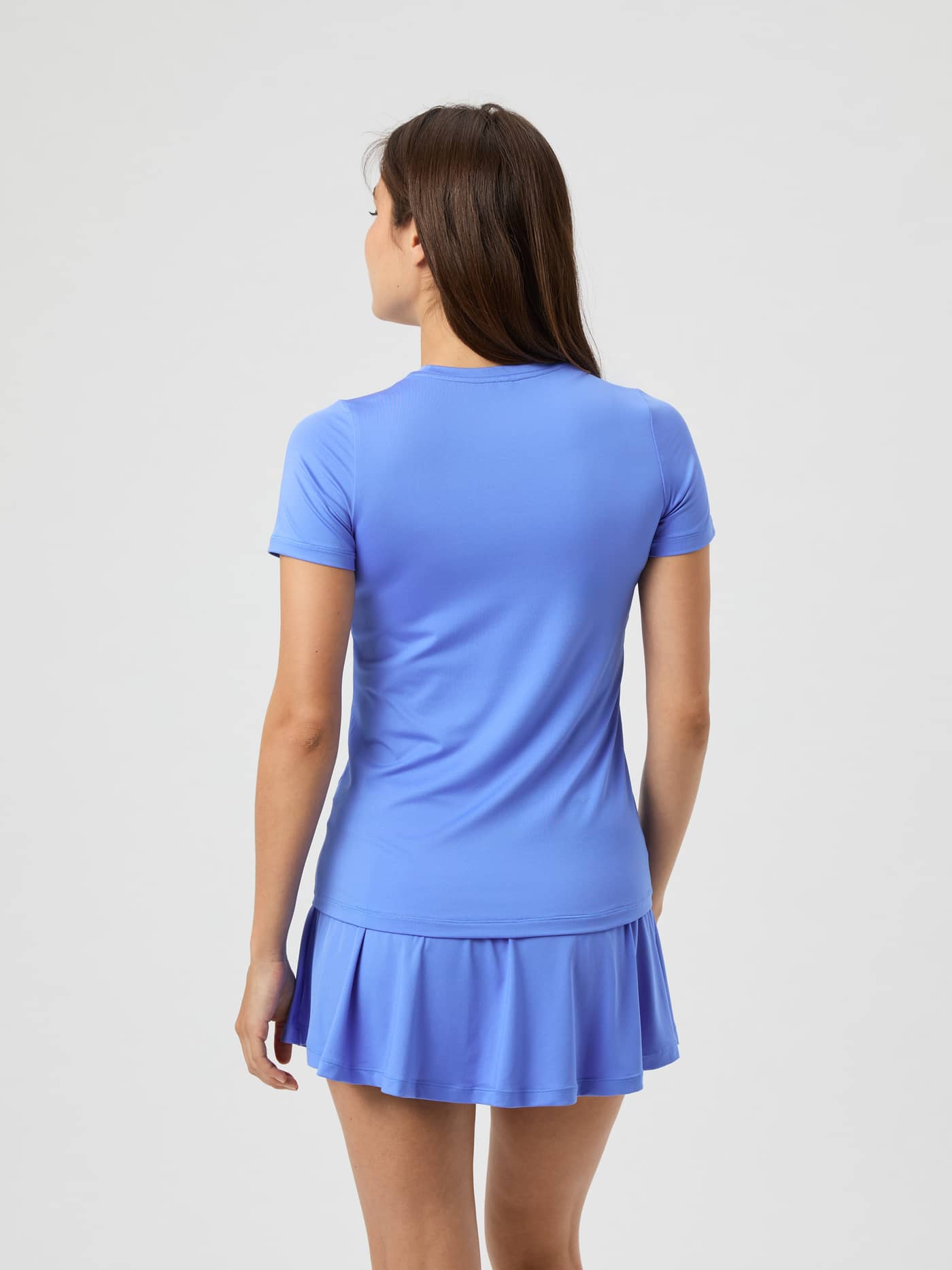 Back view of a woman wearing the Ace Slim T-Shirt in Ultramarine. - Image 3