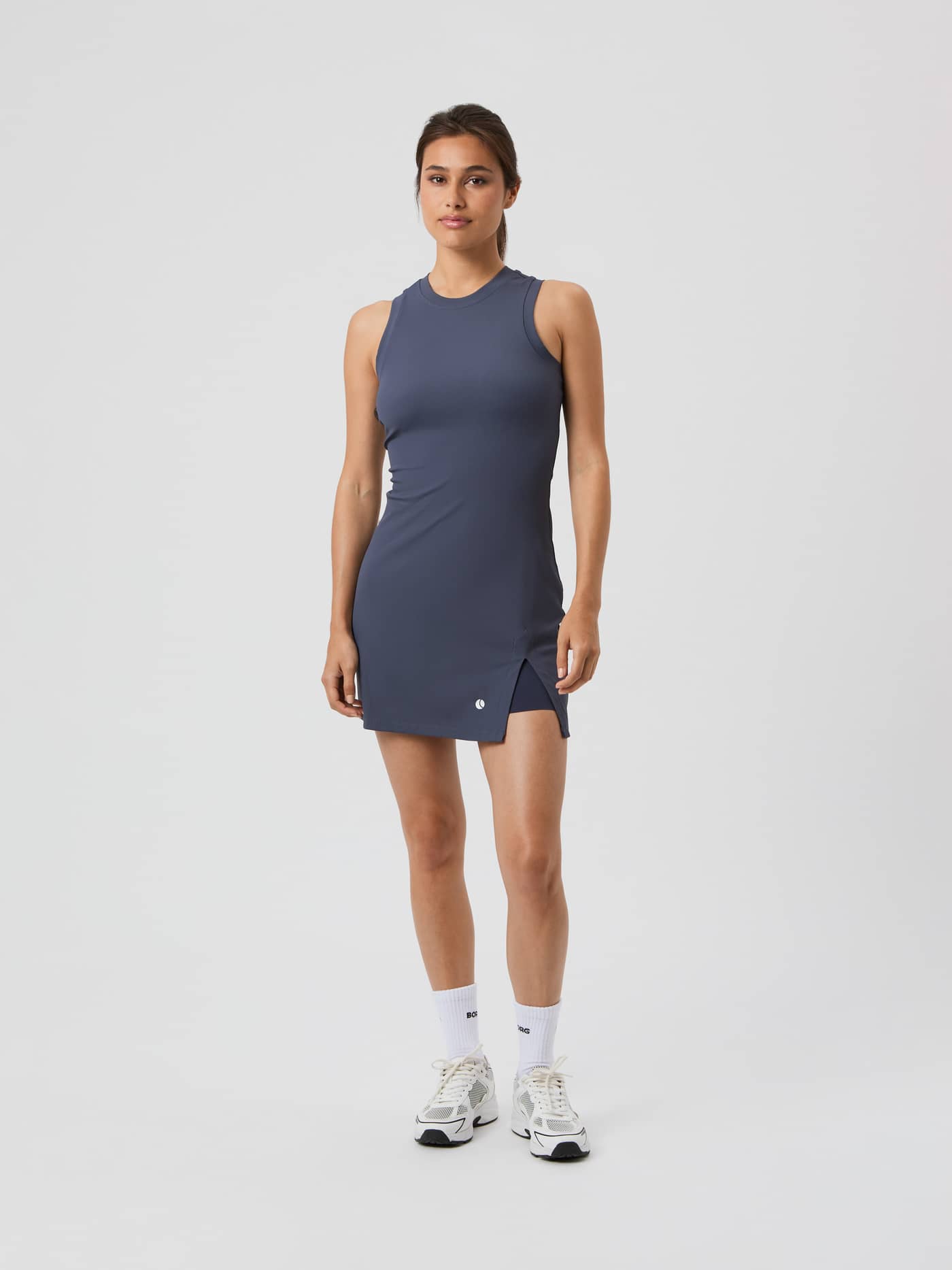 Full-body front view of a model in the Björn Borg Ace Ribbed Dress in Odyssey Gray (Grey) for tennis with a white logo. - Image 3