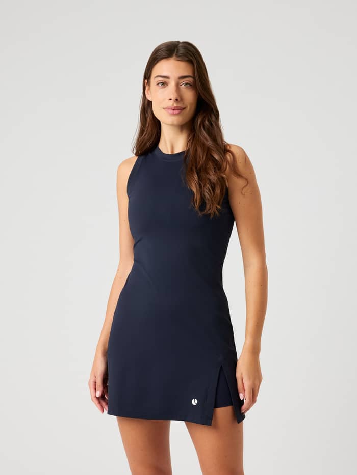 Front view of a model wearing the slim-fit Björn Borg Ace Ribbed Dress in Night Sky (Navy), designed for tennis performance.