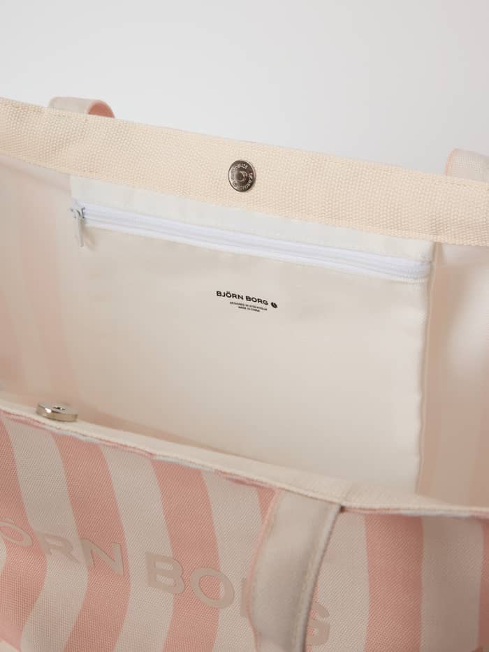 Interior of the striped Borg Beach Tote M - 27L in Rose Cloud (Pink) showing the zippered pocket and black logo.