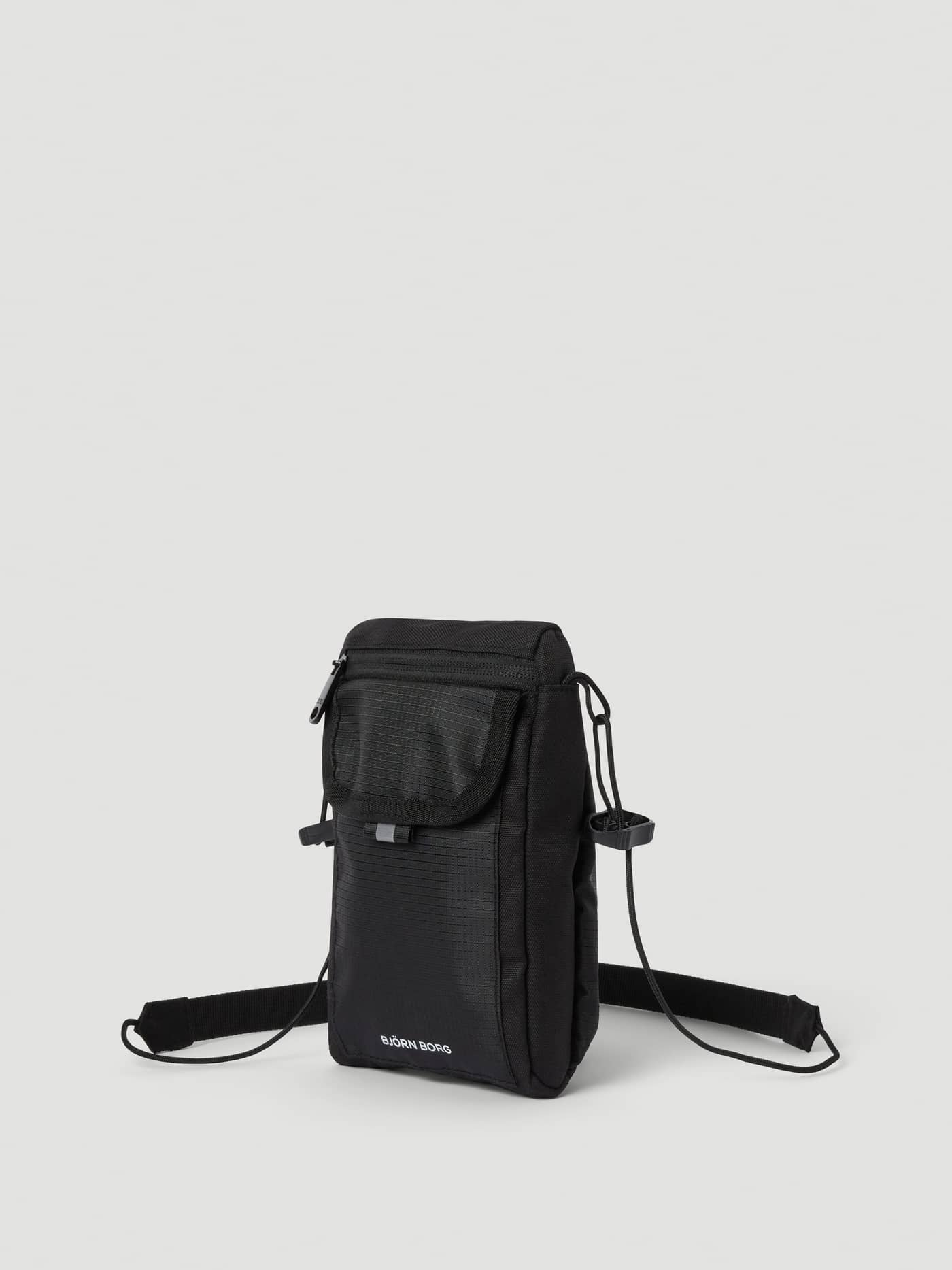 Front view of the Borg Crossover Bag S in Black Beauty (Black), featuring a white logo and durable recycled polyester. - Image 3