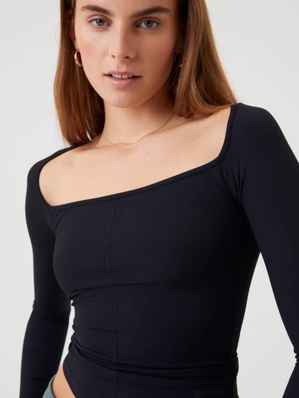 Björn Borg Studio Ballerina Long Sleeve in Black Beauty (Black), a slim-fit training top with a rounded square neckline.