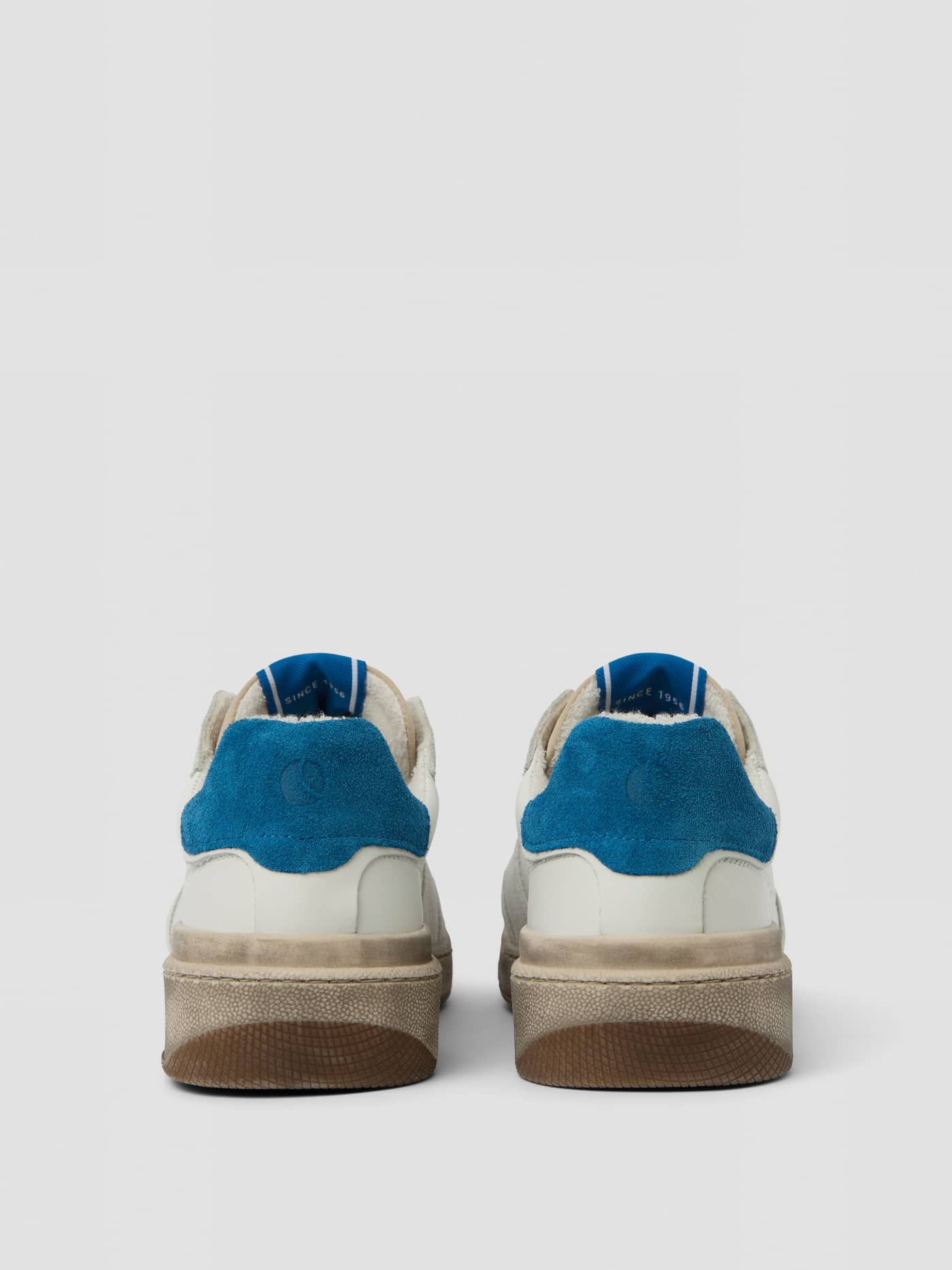 Back view of the white and blue Men's Baseline Sneakers in leather and nylon, featuring a heritage tennis style. - Image 3