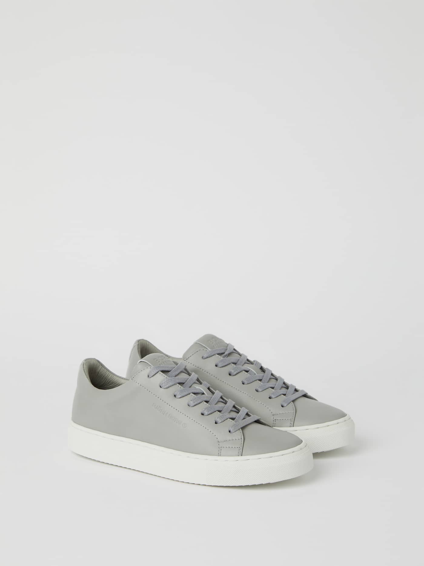 Grey Womens Leather sneakers Sl100 in a tennis-inspired low-top style with a matching grey logo and sleek fit. - Image 1