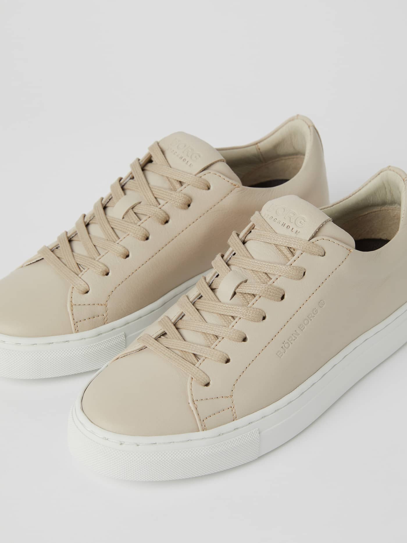 Front view of the Womens Leather sneakers Sl100 in Beige, featuring a quality leather finish and white rubber sole. - Image 3