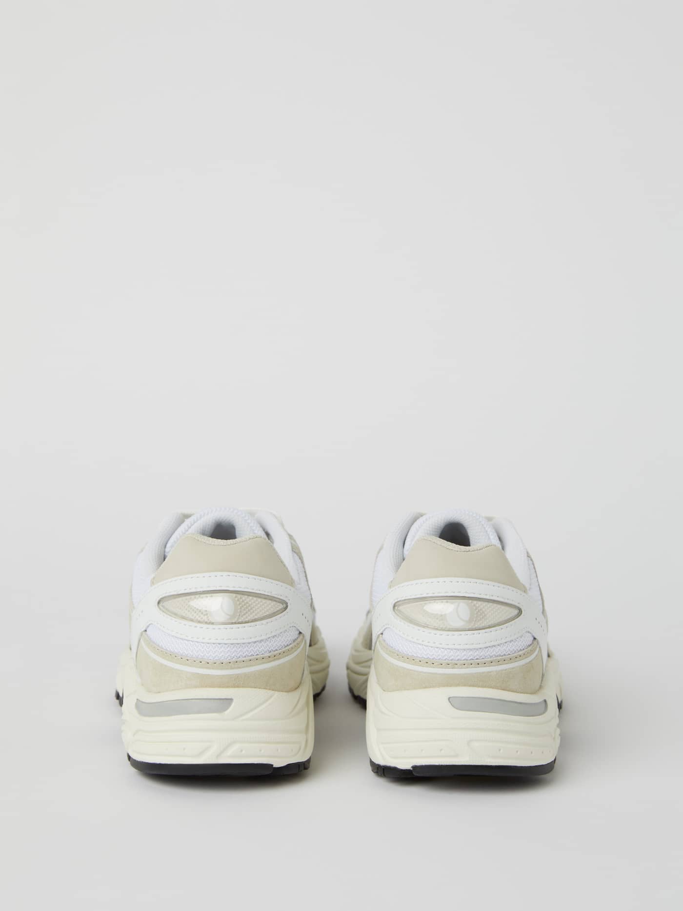 Back view of the white leather Women's Alley Sneakers, highlighting the supportive heel for running and style. - Image 3