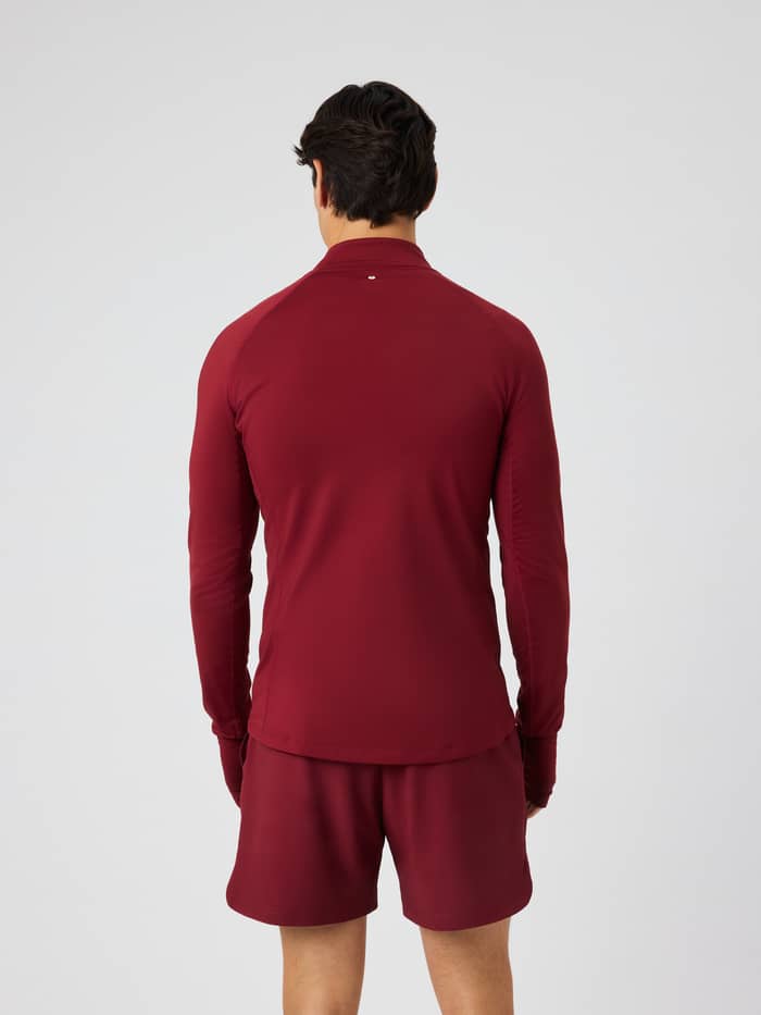 Back view of the Borg Midlayer Half Zip in Cabernet (Burgundy) for training, showing raglan sleeves and side panels.