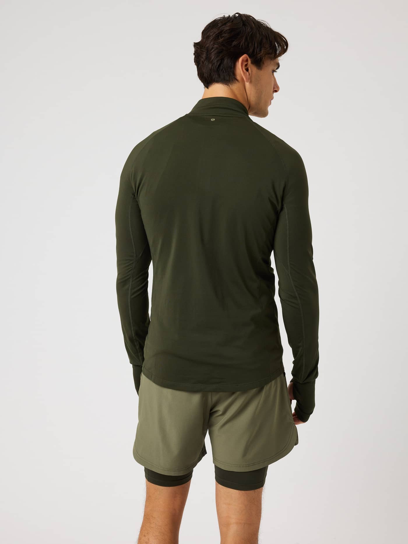Back view of the Borg Midlayer Half Zip in Rosin (Green), a training top with functional thumbhole openings. - Image 3