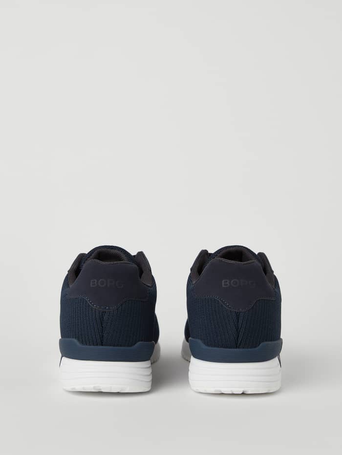 Back view of the Björn Borg Men’s sneakers R140 Knit in Navy, with a breathable knit upper and Navy logo for running. - Image 2