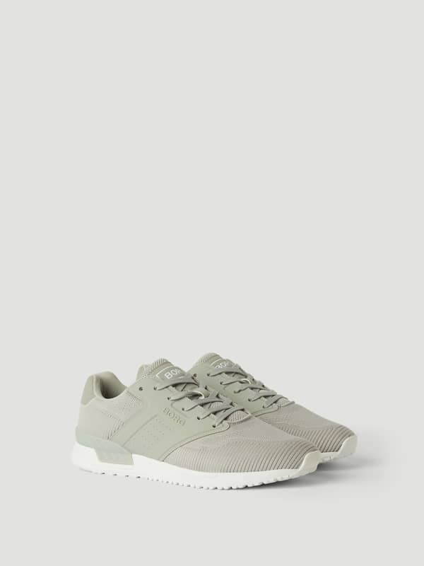 Vue de côté des Men’s sneakers R140 Knit gris, chaussure de running respirante avec semelle en caoutchouc.