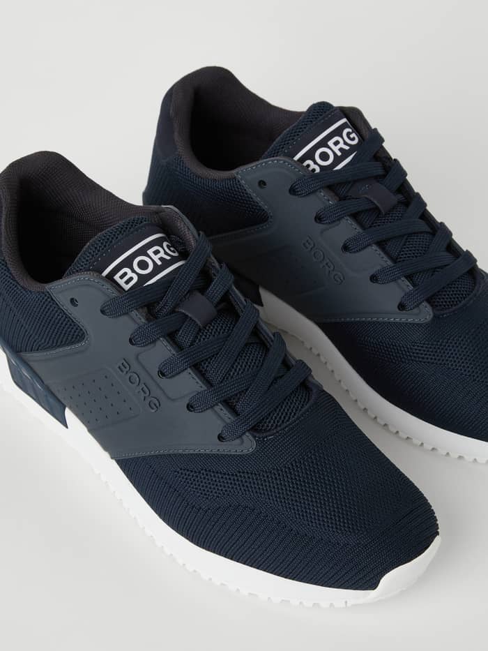 Men’s sneakers R140 Knit i Navy til running med en åndbar strikket overdel og hvide logodetaljer.