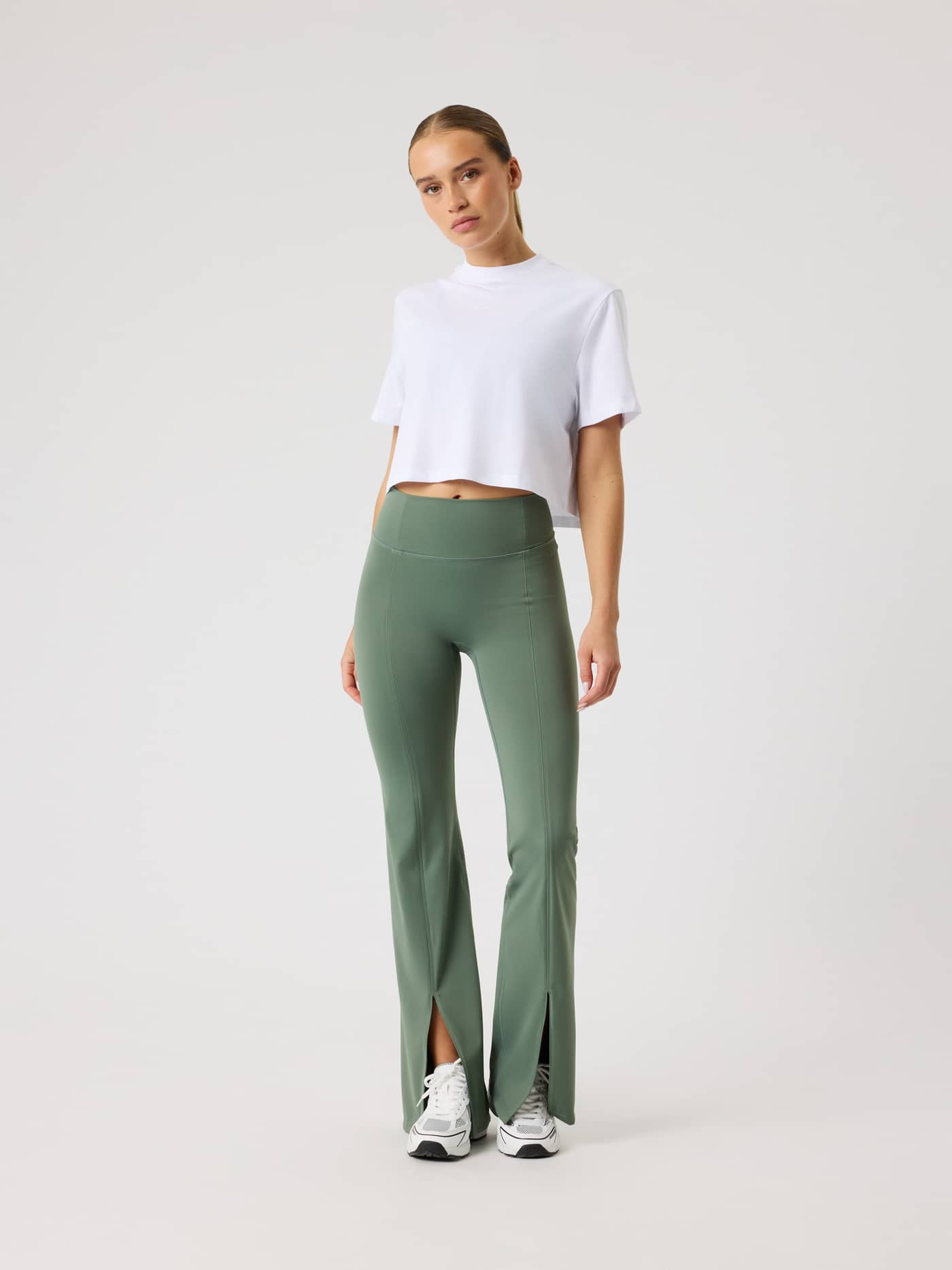 Front view of a woman in the cotton Studio Oversized Cropped T-Shirt in Brilliant White (White) for training. - Image 3