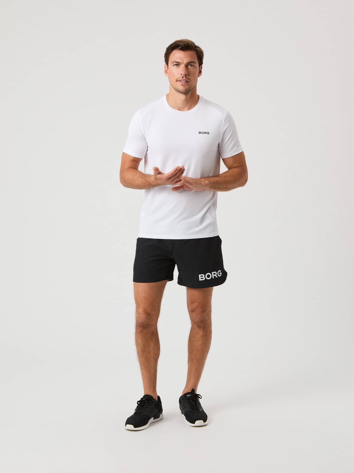 Full-body front view of a man in the breathable, perforated Borg Airy T-Shirt in Brilliant White (White) for training. - Image 3