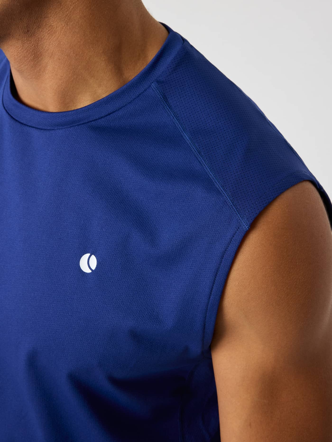 Detailed close-up of the Ace Mesh Panel Tank in Blue Depths (Blue), showcasing breathable mesh panels for tennis. - Image 4