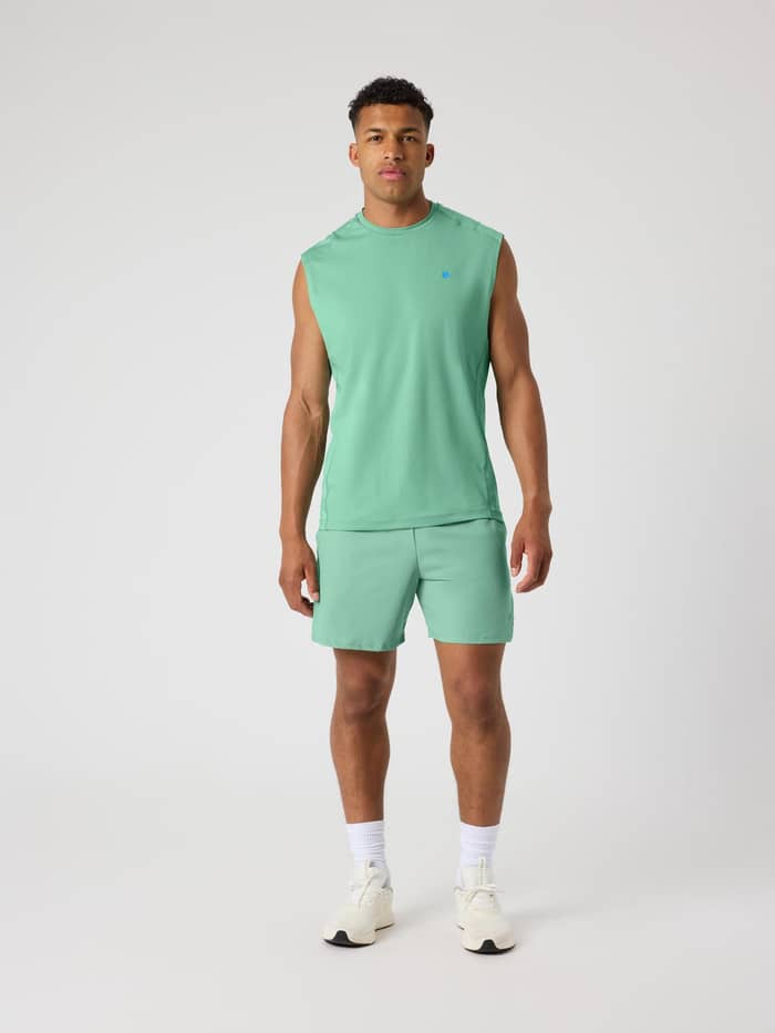 Full-body front view of a man in the Björn Borg Ace Mesh Panel Tank in Malachite Green (Green) and matching tennis shorts. - Image 3