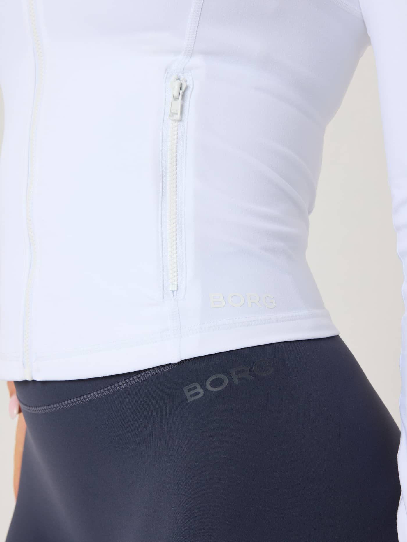 Alice Stenlöf Soft Zip Midlayer in Brilliant White (White) for training, featuring a slim fit and white BORG logo. - Image 4