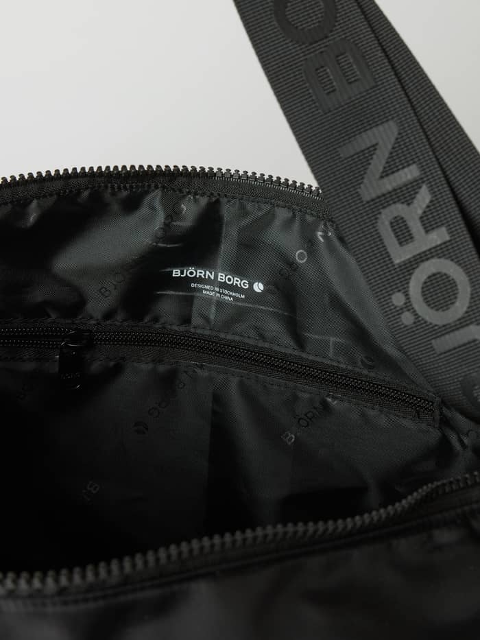 Interior view of the training Borg Classic Shoulder Bag 13L in Black Beauty (Black) with a logo strap and white logo. - Image 3