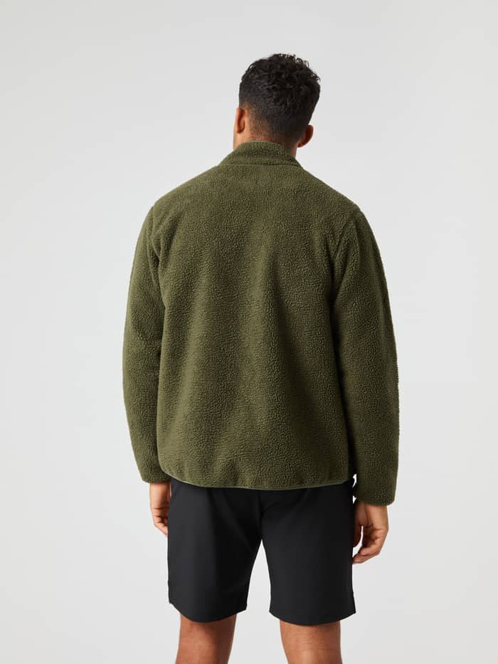 Back view of a man wearing the functional Björn Borg Centre Pile Jacket in Forest Night (Green) with a stylish fit. - Image 2