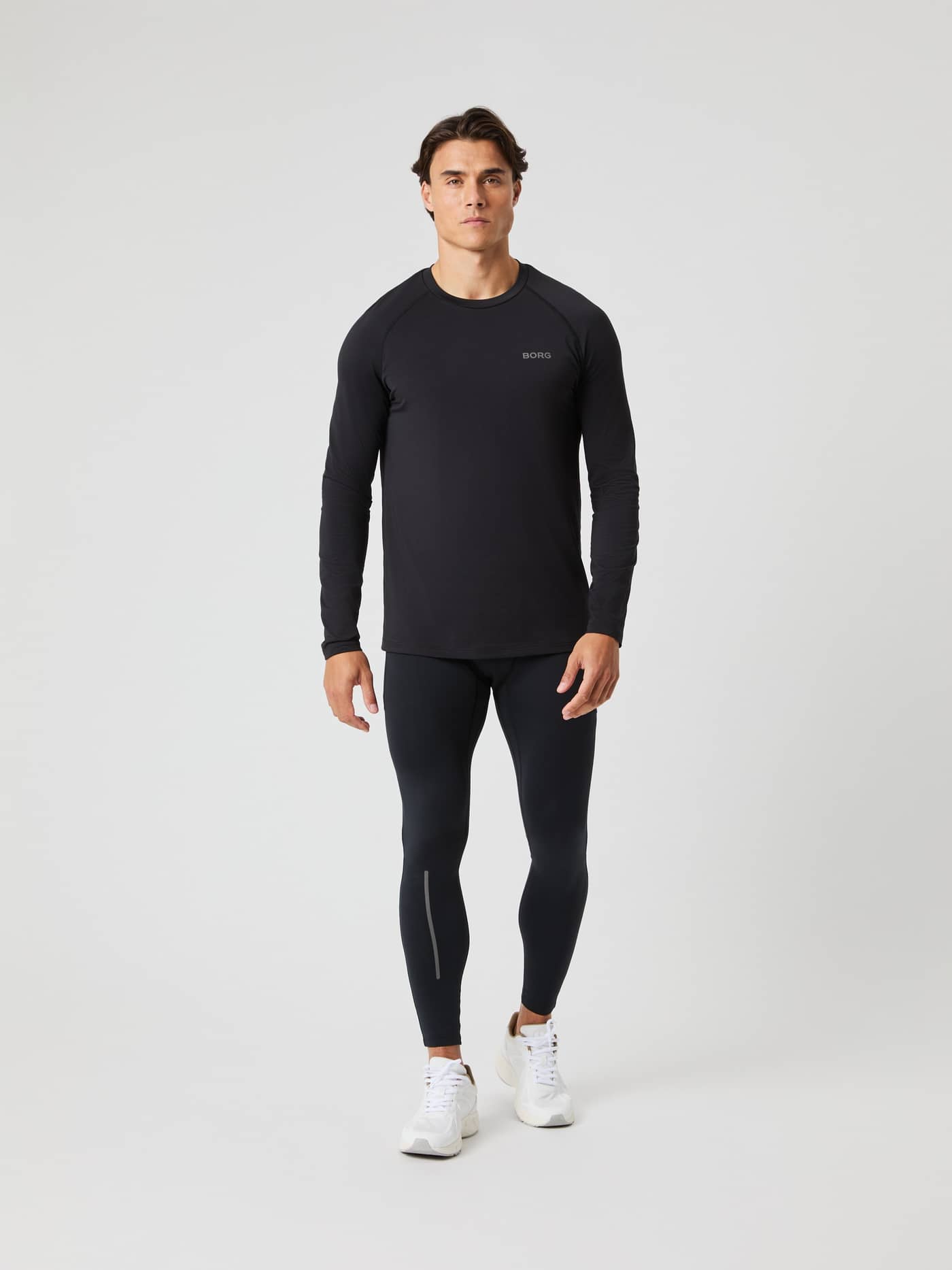 Full-body front view of a man wearing the Borg Performance Long Sleeve Brushed T-Shirt in Black Beauty (Black) for running. - Image 3