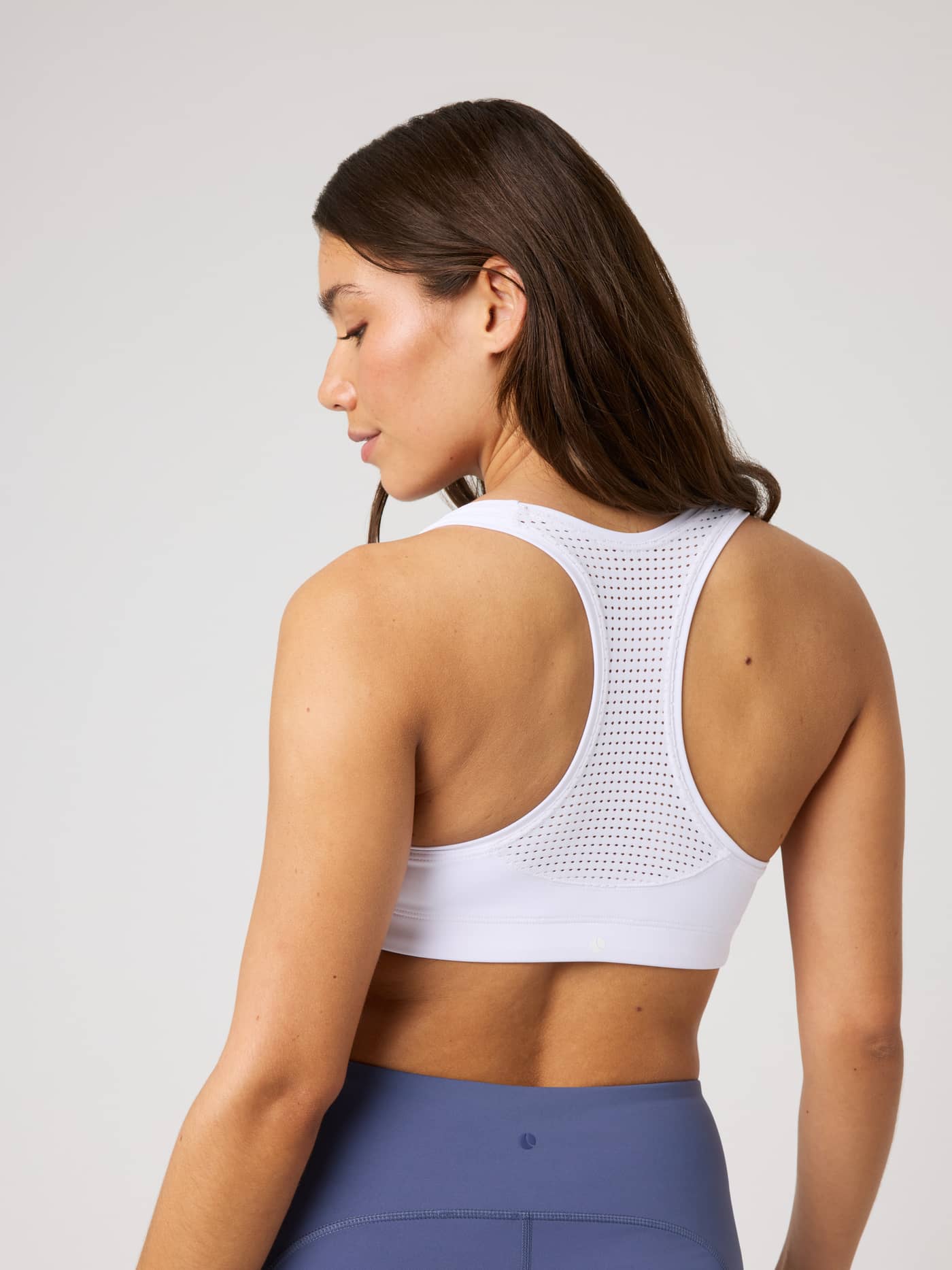 Back view of the Borg Mid Support Sports Bra in Brilliant White (White) with a breathable mesh racerback for training. - Image 2