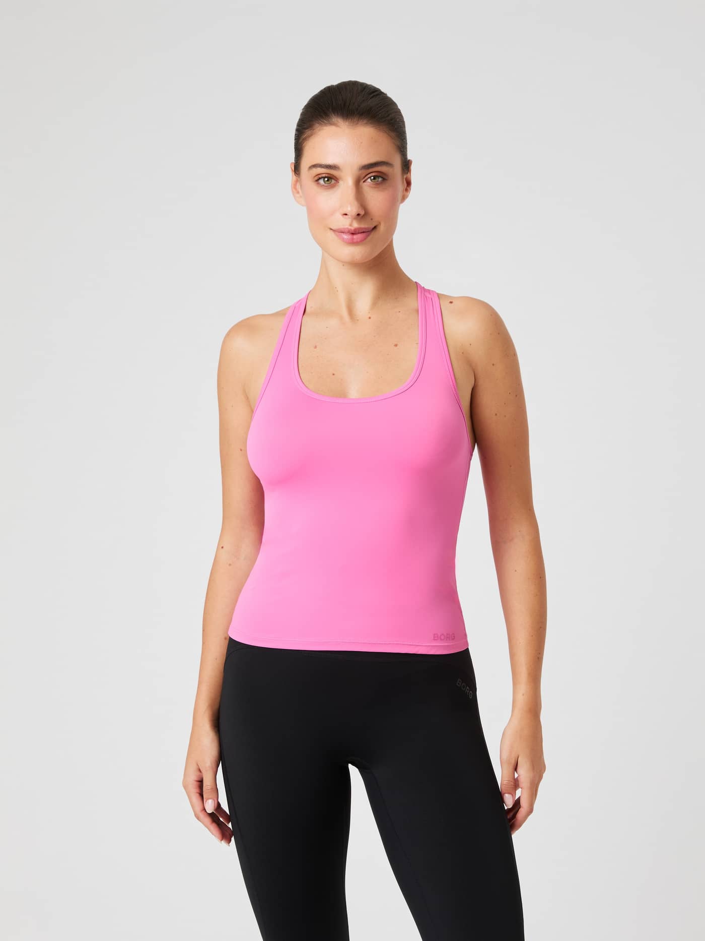 Borg Soft Racerback Tank Top in Ibis Rose (Roze) in vooraanzicht, met een stijlvolle pasvorm voor training. - Image 1