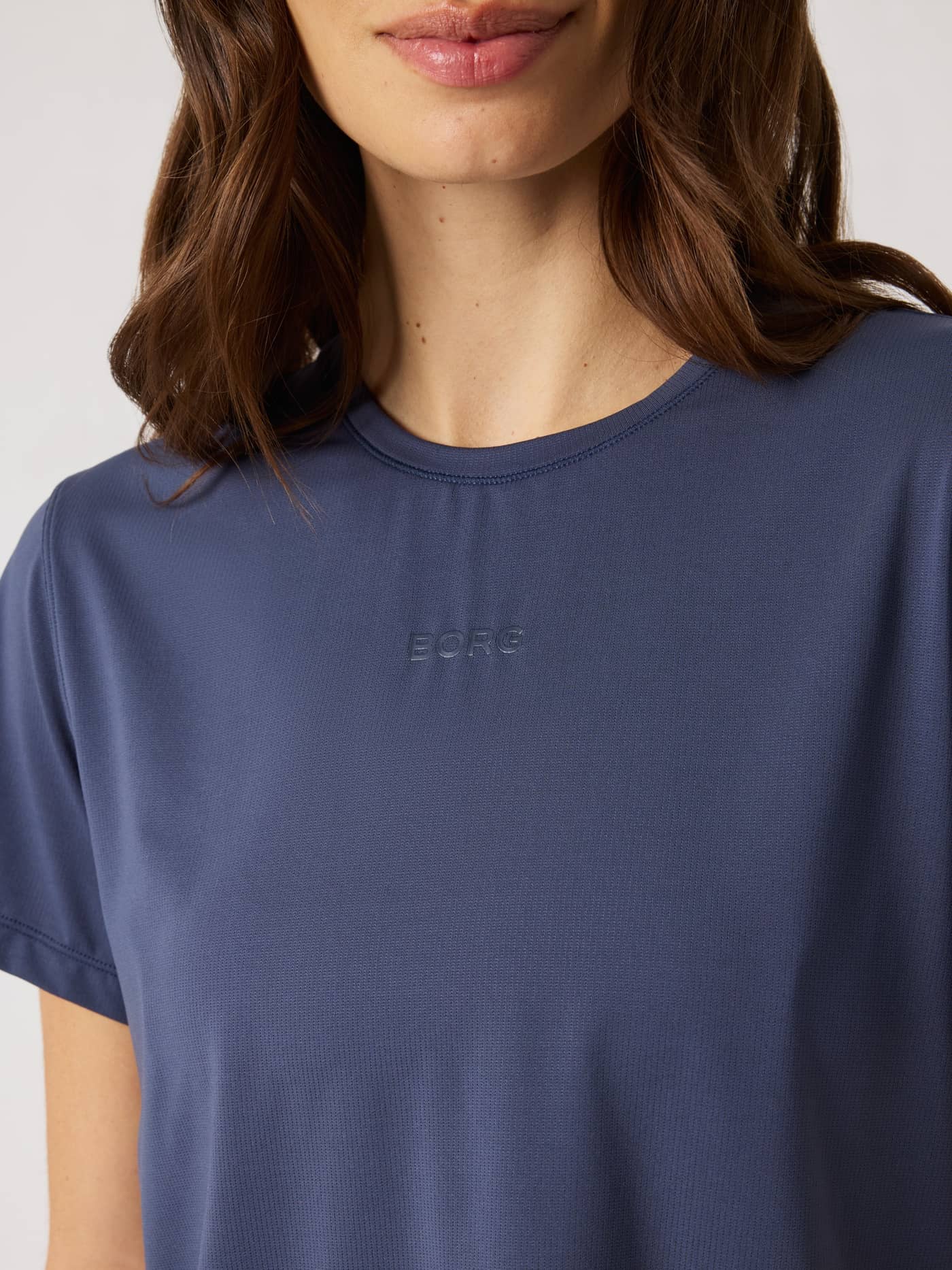 Close-up of the Odyssey Gray (Navy) Borg Cropped T-Shirt for training, with a tonal logo and stylish performance fit. - Image 5
