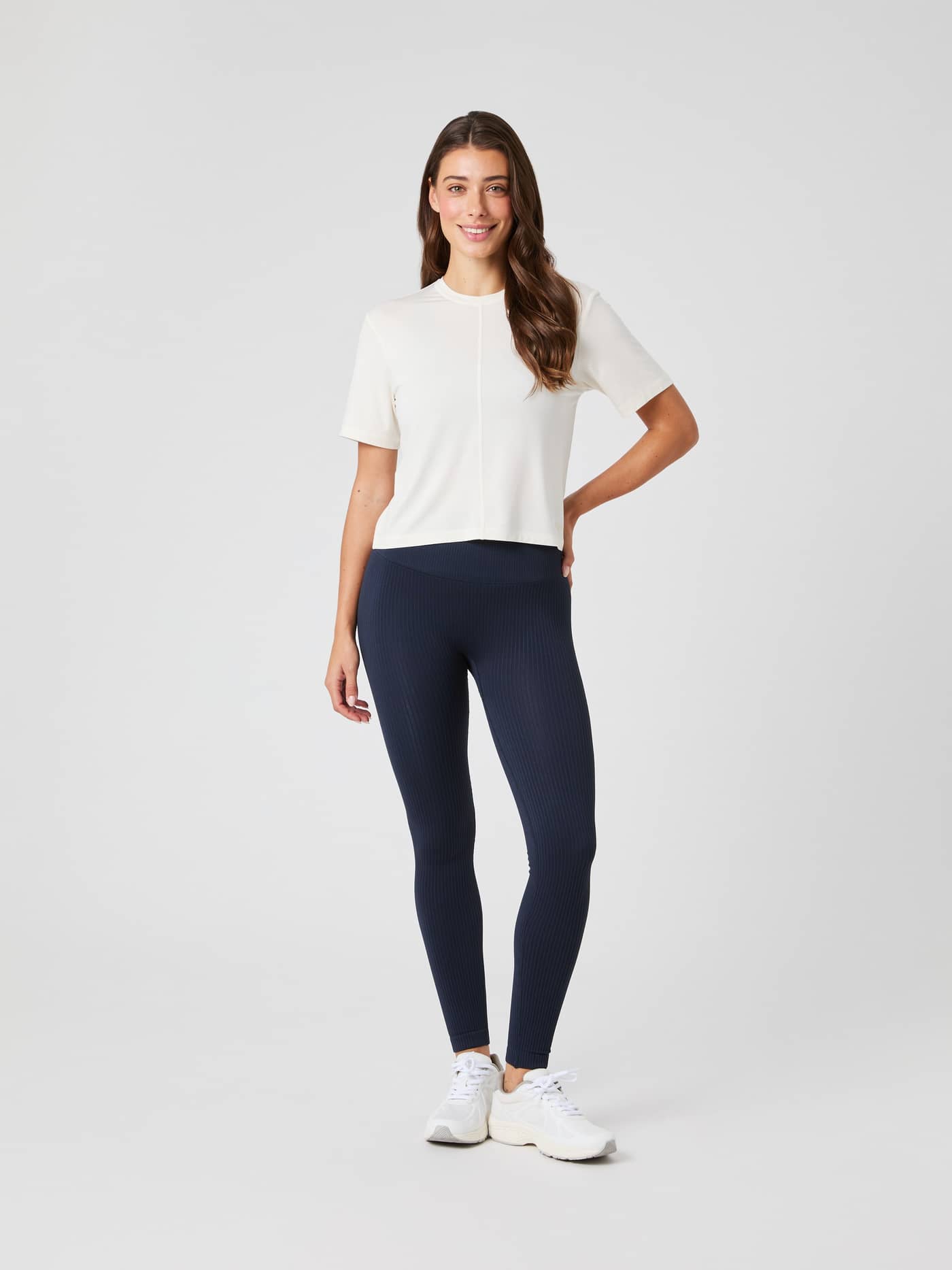 Full-body front view of a woman wearing the Studio Soft T-Shirt in Tofu (White) for a soft, cropped training fit. - Image 4