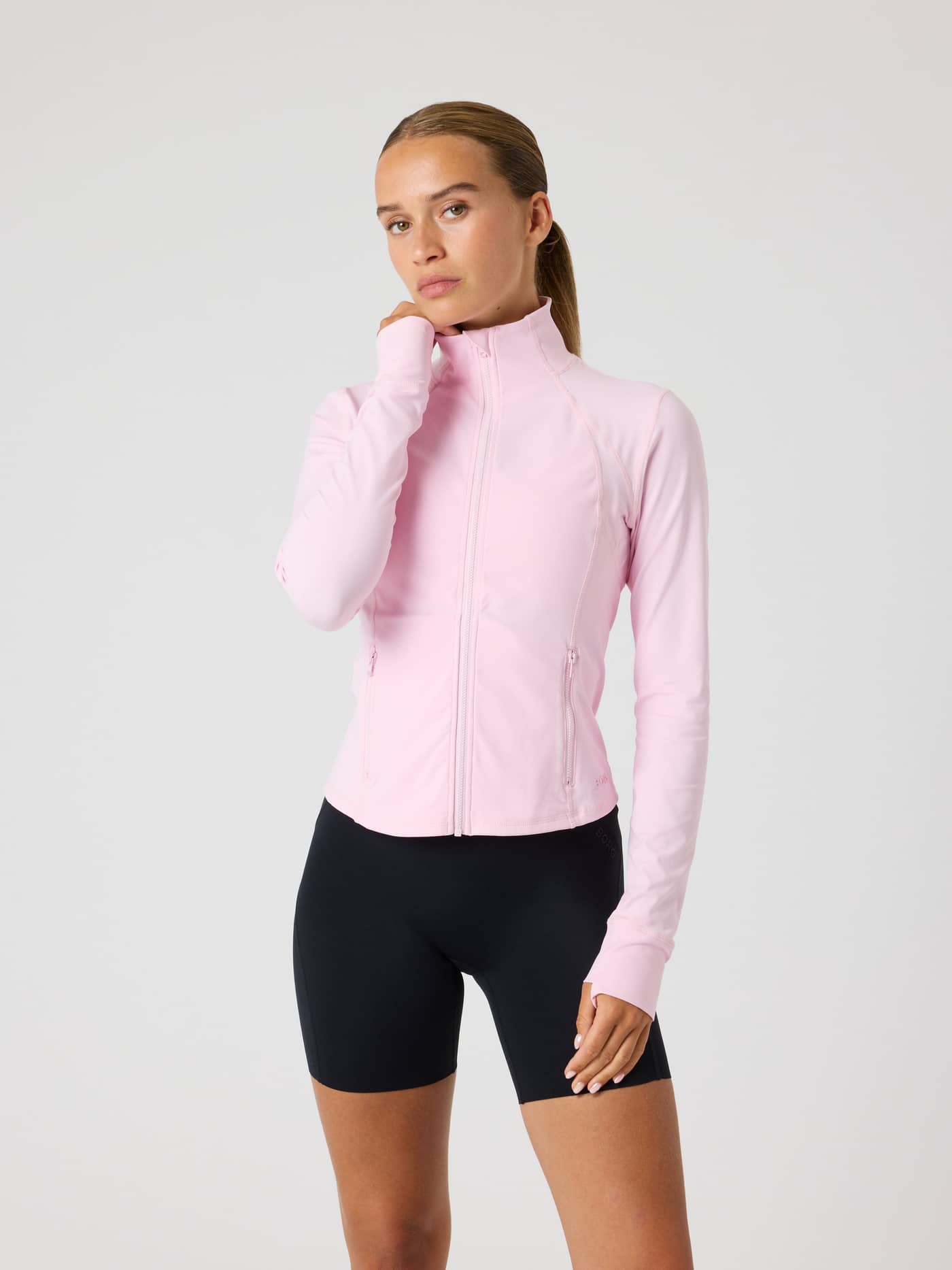Front view of a model in the Pink Lady (Pink) Borg Soft Zip Midlayer, a training top with a flattering performance fit. - Image 2