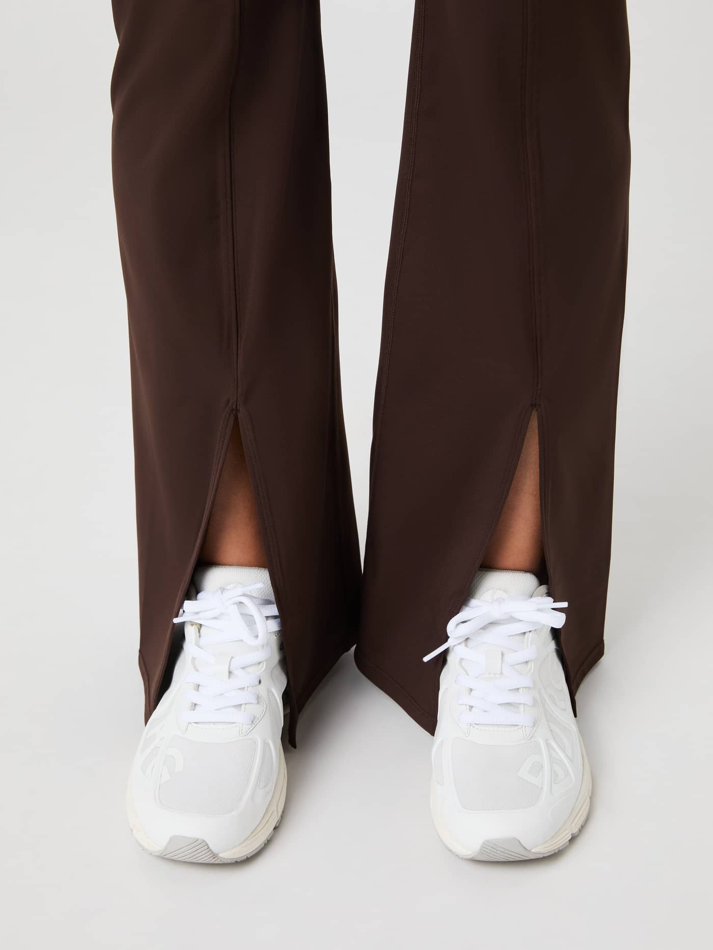 Studio Flared Slit Tights in Molé (Brown) featuring a flared leg and front slit detail for a stylish training fit. - Image 4