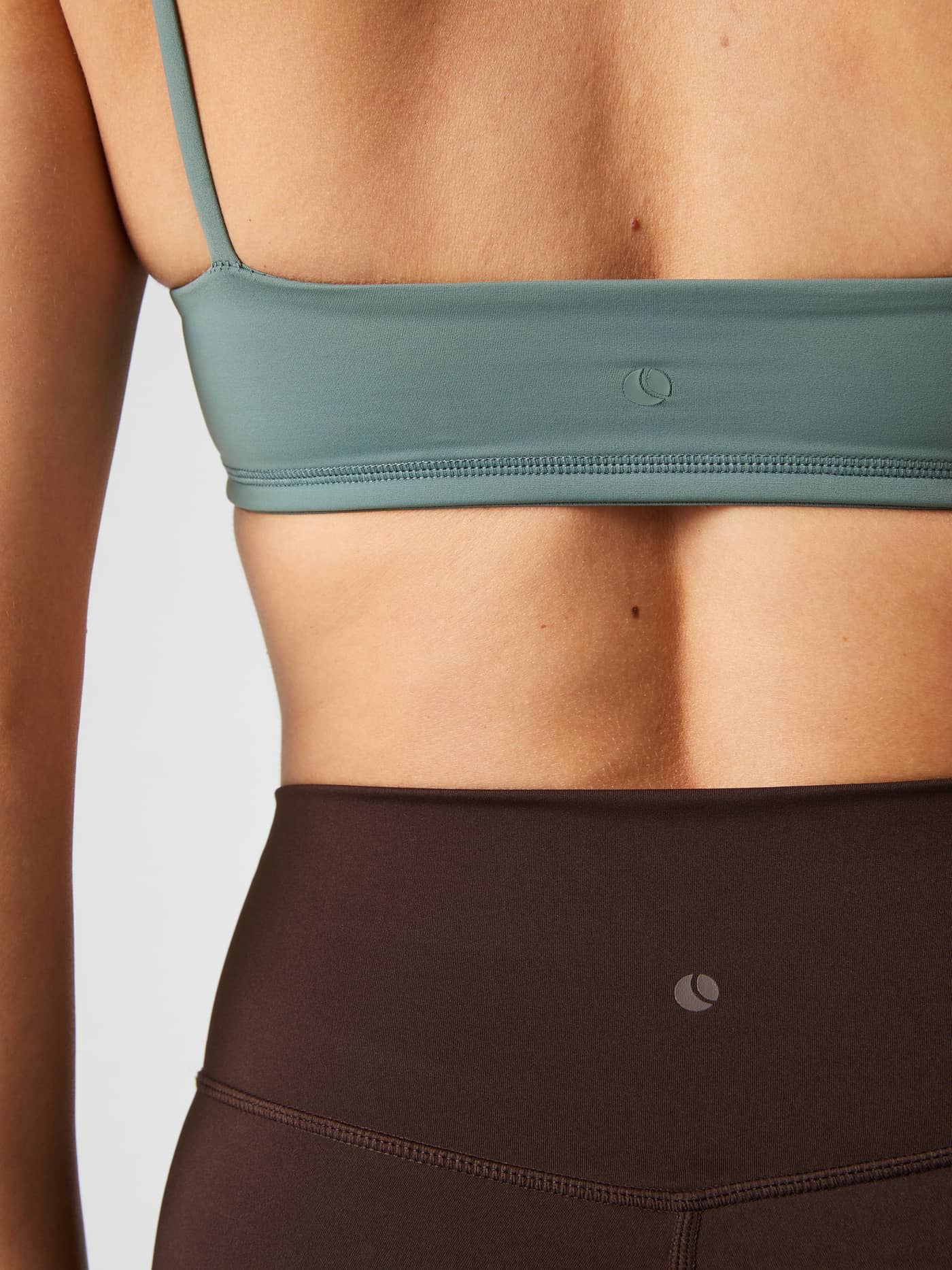 Close-up back view of the Björn Borg Studio Soft Padded Bra in Green, highlighting style, fit, and green logo for training. - Image 6