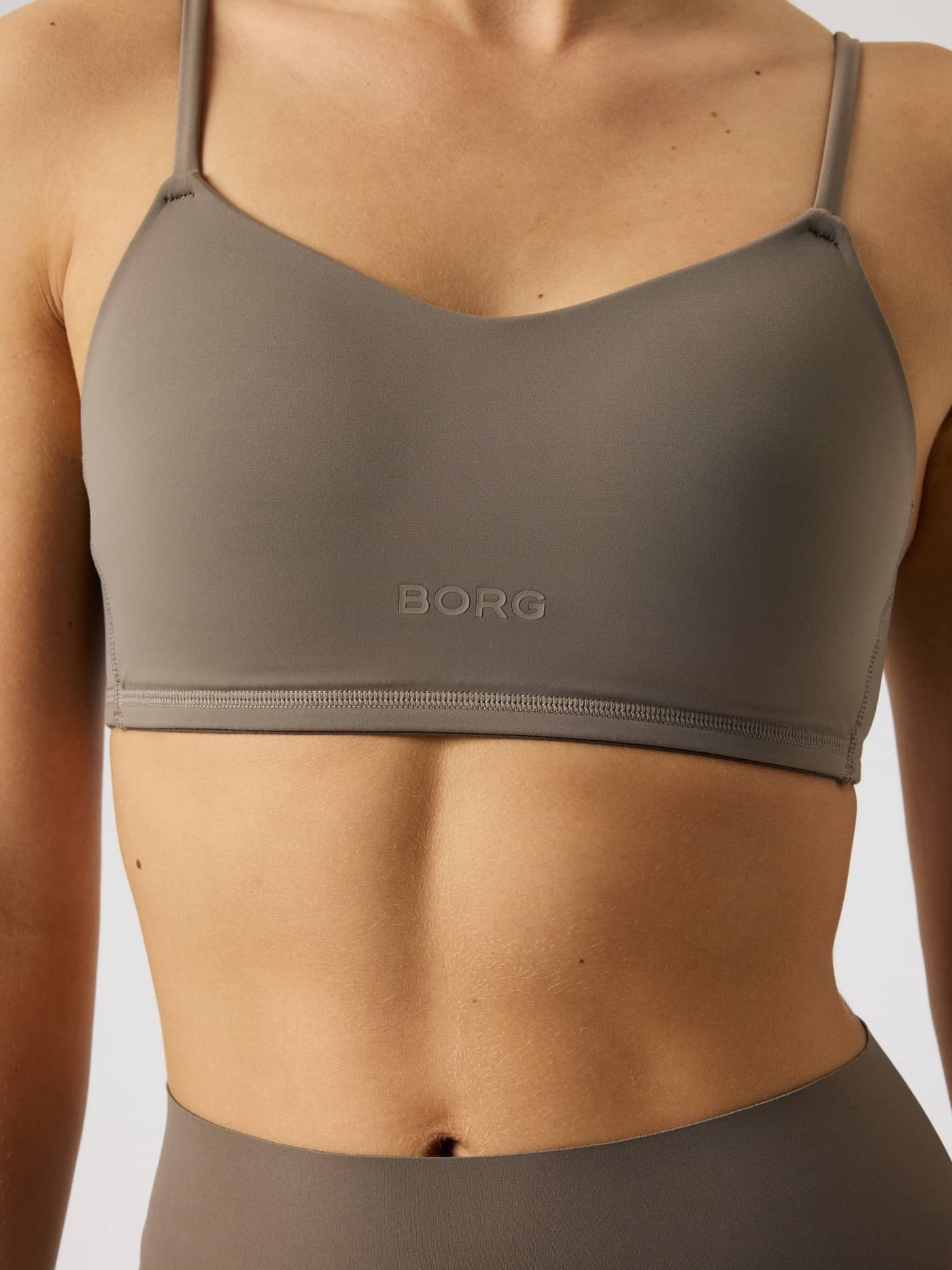 Close-up of the Falcon (Brown) Studio Soft Padded Bra for training, featuring a stylish fit and tone-on-tone BORG logo. - Image 5