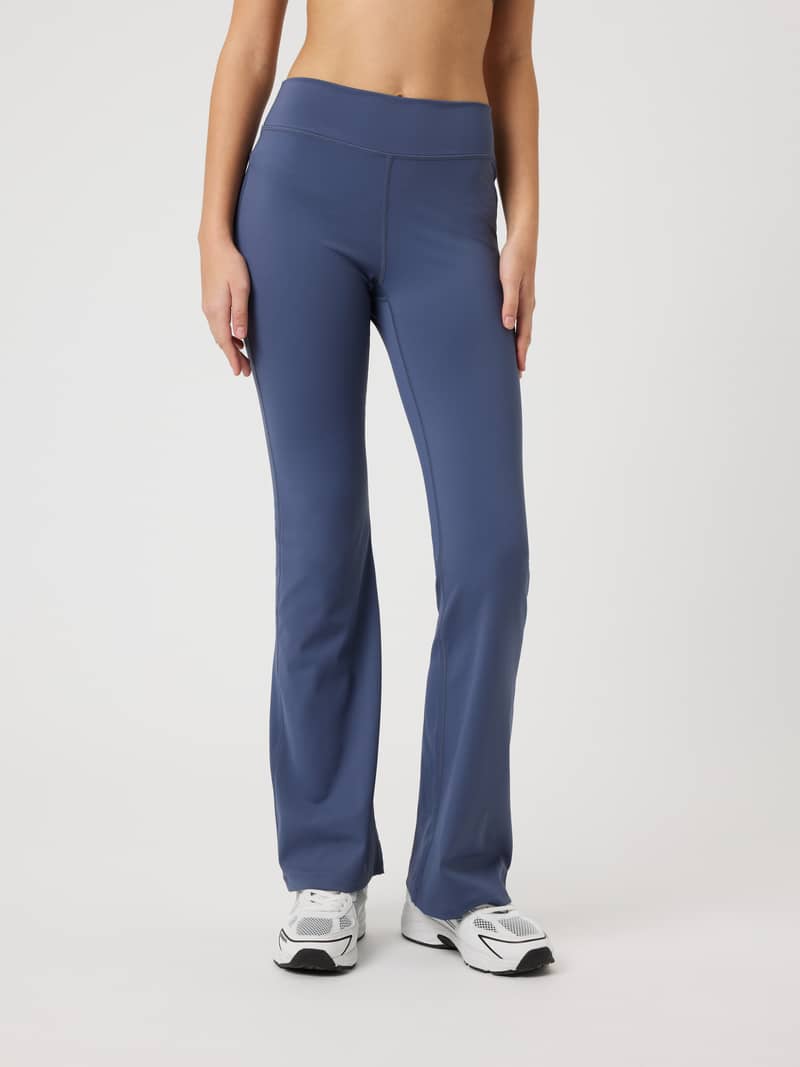 Front view of kids Borg Flare Leggings in Nightshadow Blue (Blue) featuring a flared leg for training comfort.