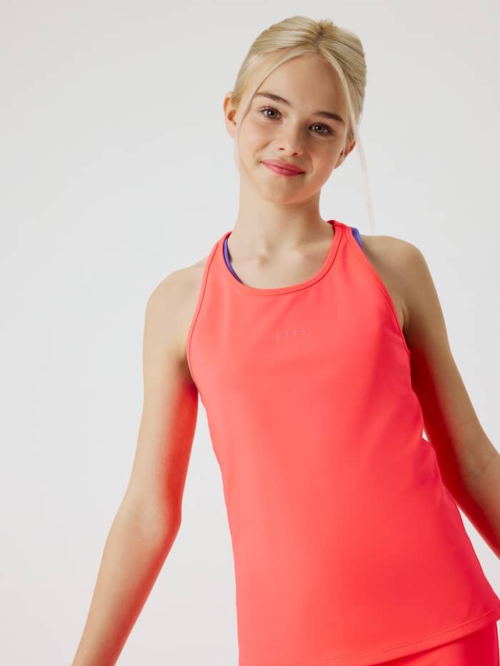 Front view of a kid wearing the Borg Racerback Tank Top in Diva Pink (Pink) for training, featuring a tonal logo. - Image 5