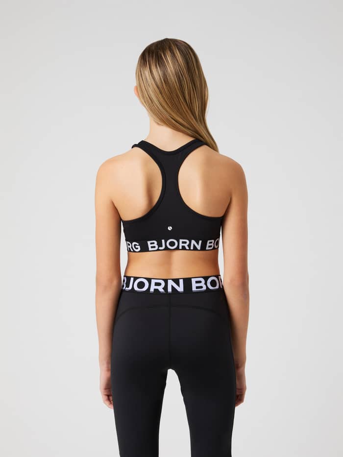 Achteraanzicht van de Borg Sports Top voor kids in Black Beauty (Zwart) met wit logo en racerback voor training. - Image 2