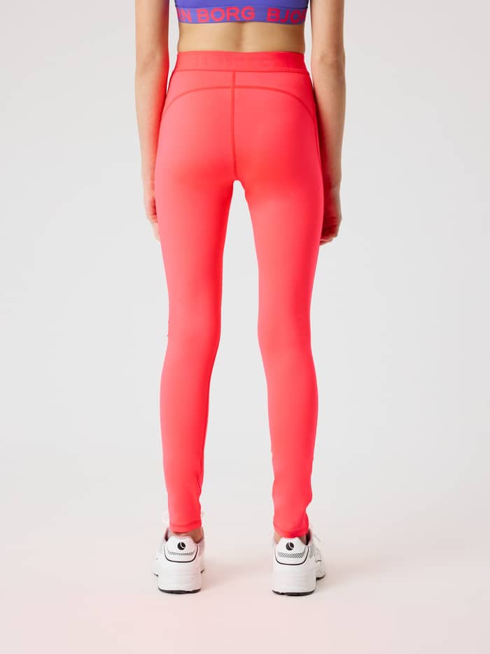 Back view of a kid wearing the Borg Leggings in Diva Pink (Pink), featuring a slim fit for training performance. - Image 3