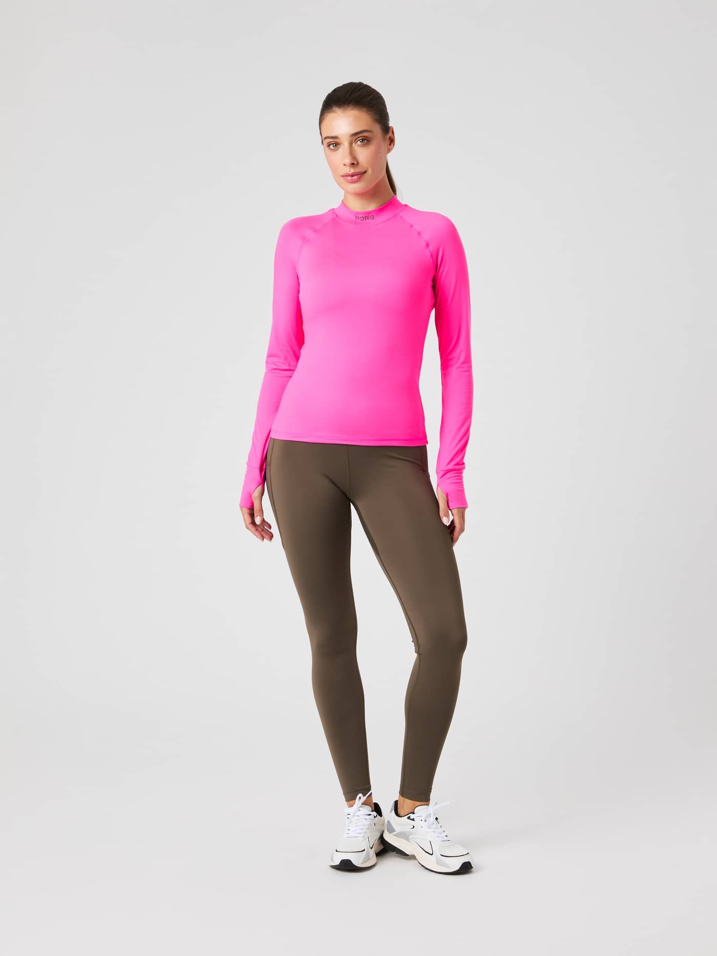 Full-body front view of a woman in stylish Pink Glo (Pink) Borg Performance Brushed Mockneck with black logo for running fit. - Image 4