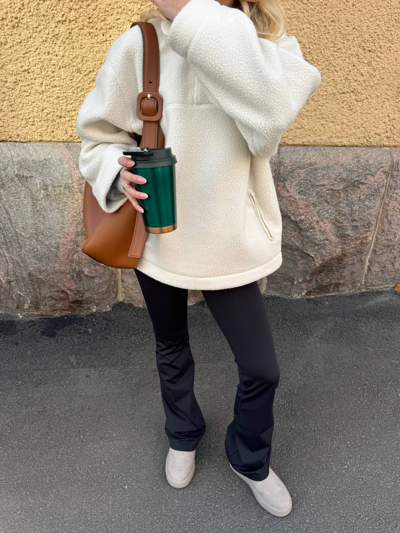 Front view of a woman in the oversized Studio Pile Anorak in Tofu (White), featuring a stylish fit and soft fleece texture. - Image 1