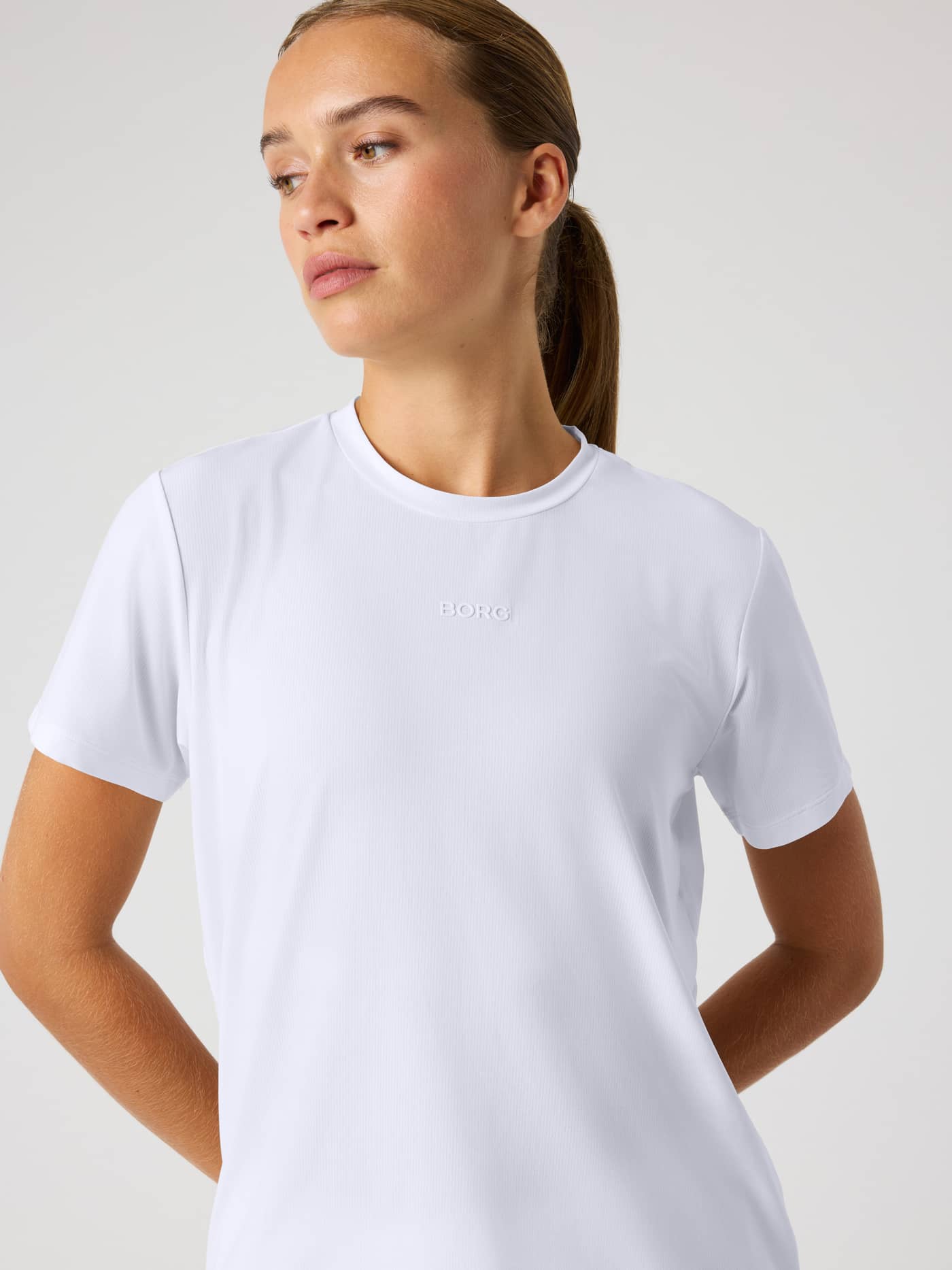 Front view of a model wearing the Björn Borg Sports T-Shirt in Brilliant White (White) for training with a white chest logo. - Image 5