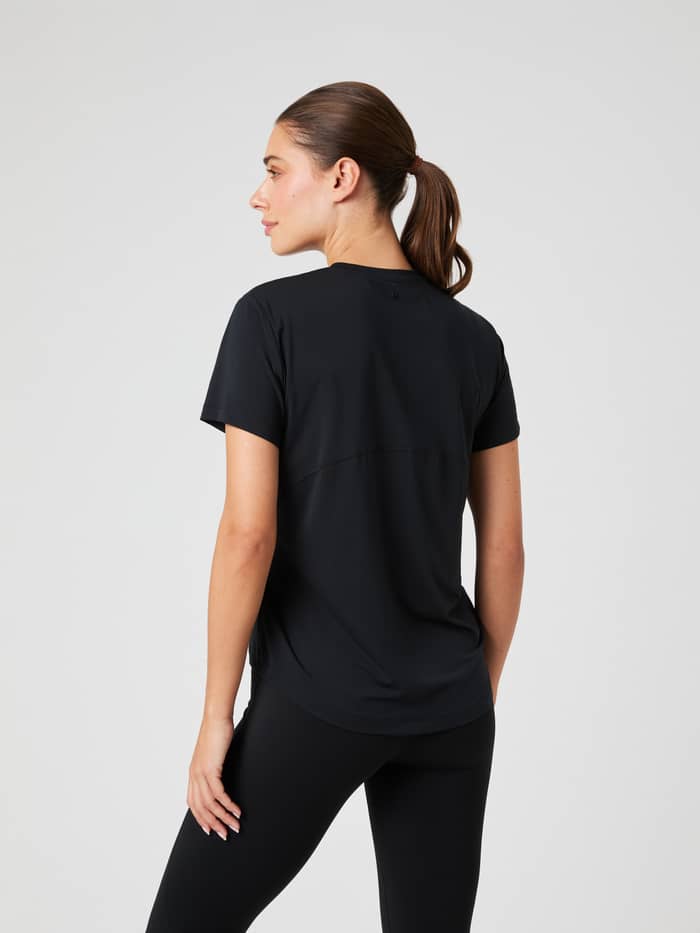 Back view of a woman in the Borg Sports T-Shirt in Black Beauty (Black), a breathable training top with a flattering fit. - Image 2