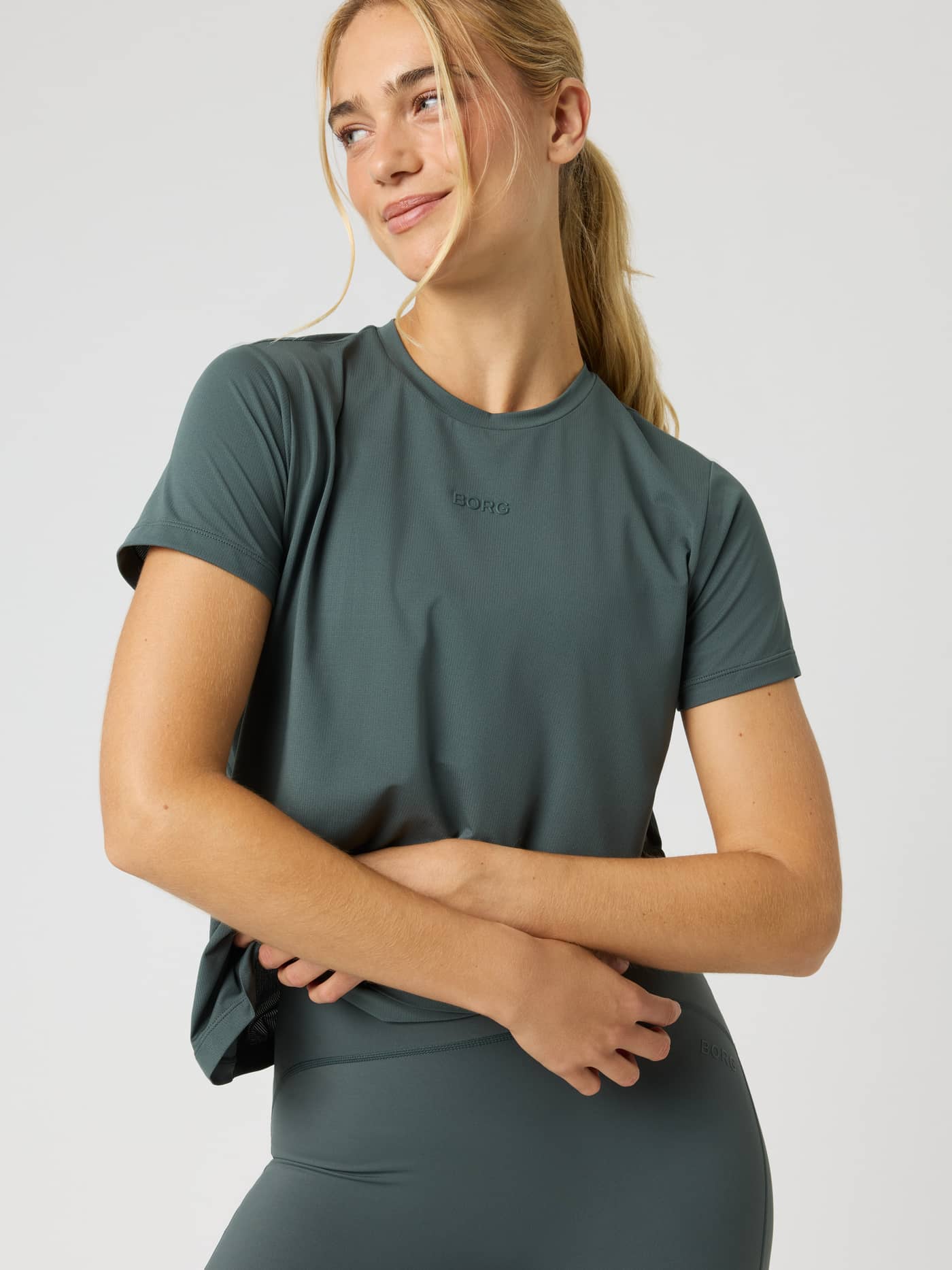 Front view of a model wearing the Borg Sports T-Shirt in Urban Chic (Green) with a matching logo for training. - Image 5