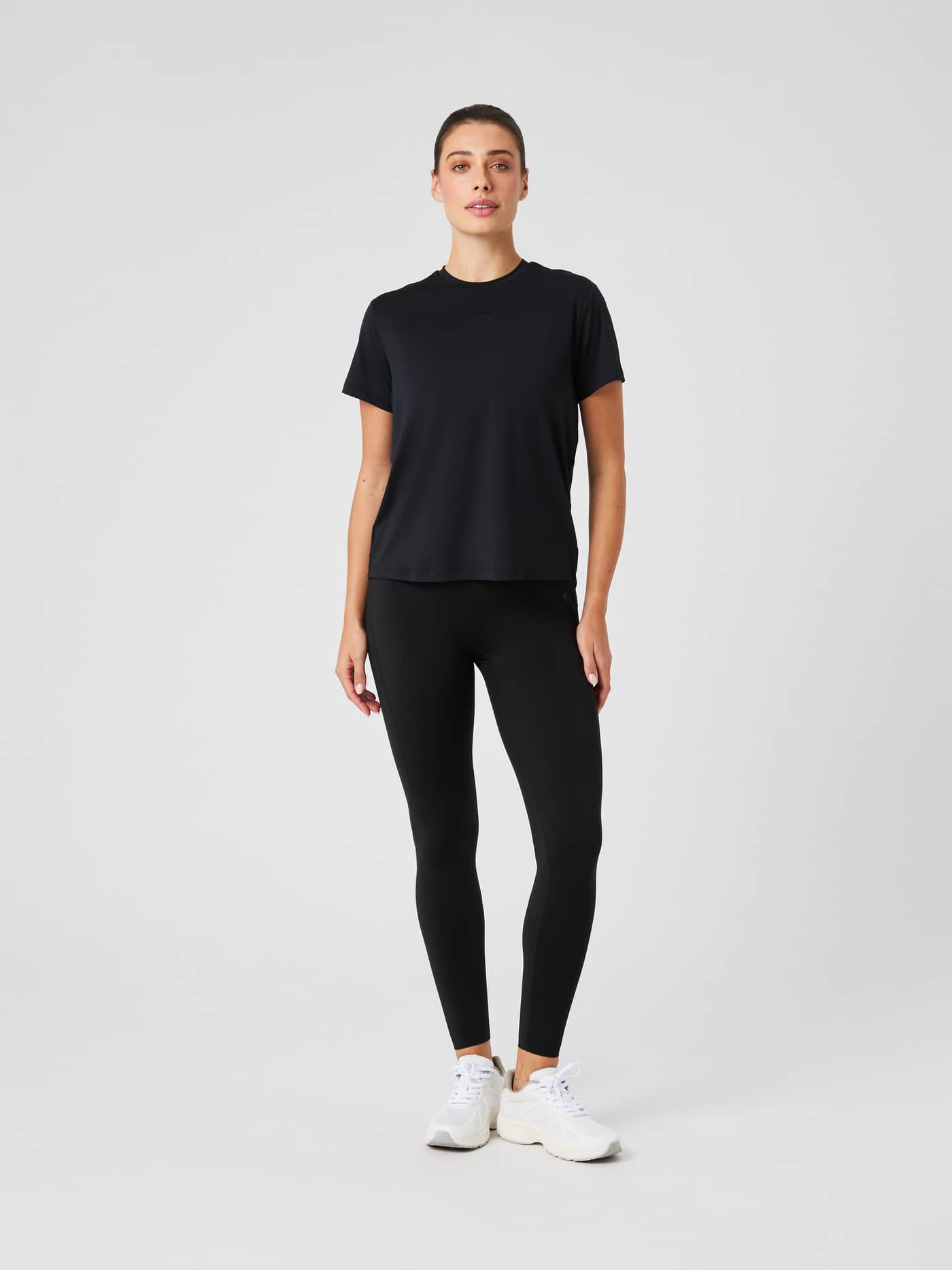 Full-body front view of a model wearing the Borg Sports T-Shirt in Black Beauty (Black) with a tonal logo for training. - Image 3