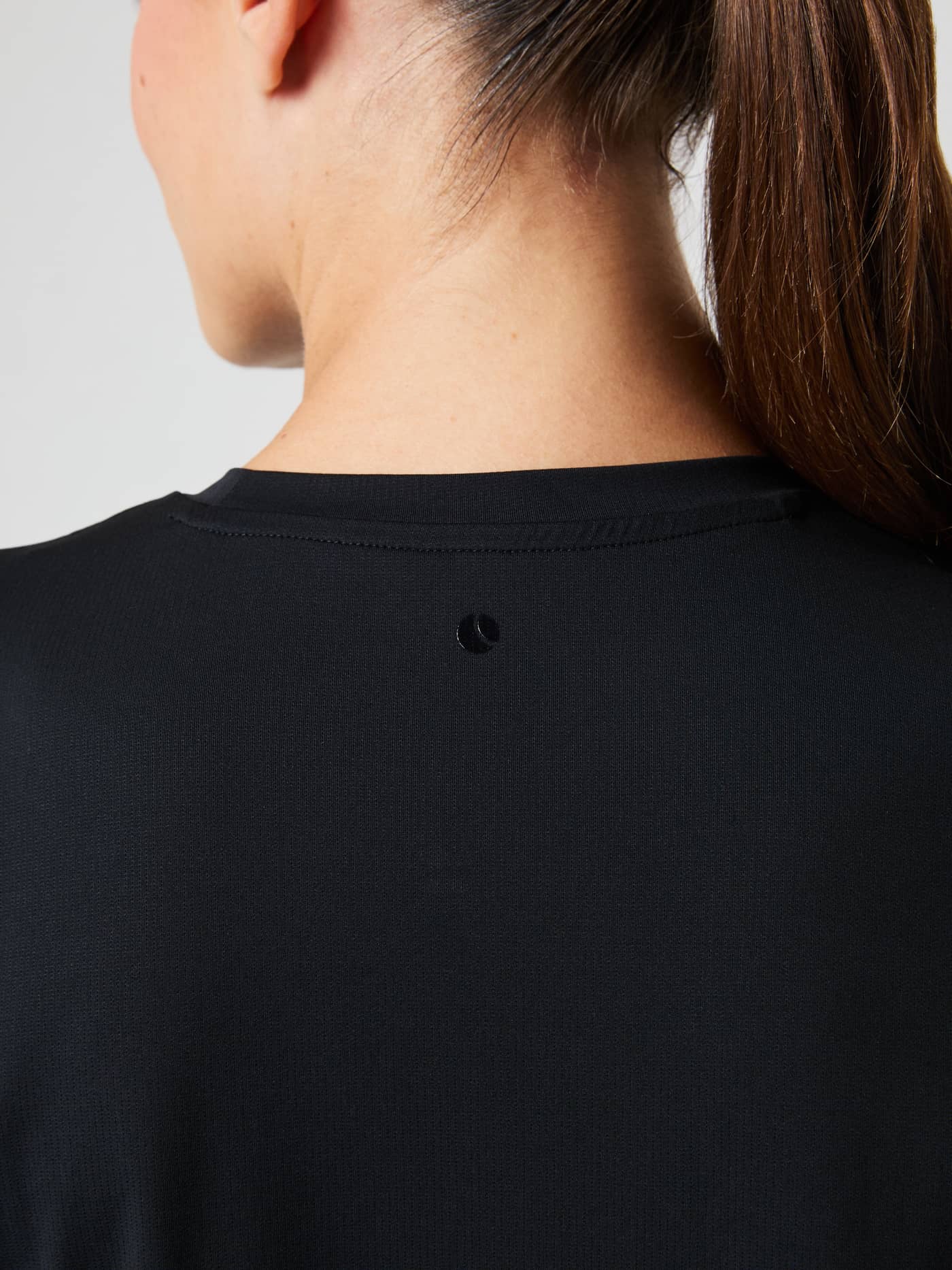 Back view close-up of the Borg Sports T-Shirt in Black Beauty (Black) featuring a tonal logo and a stylish training fit. - Image 5