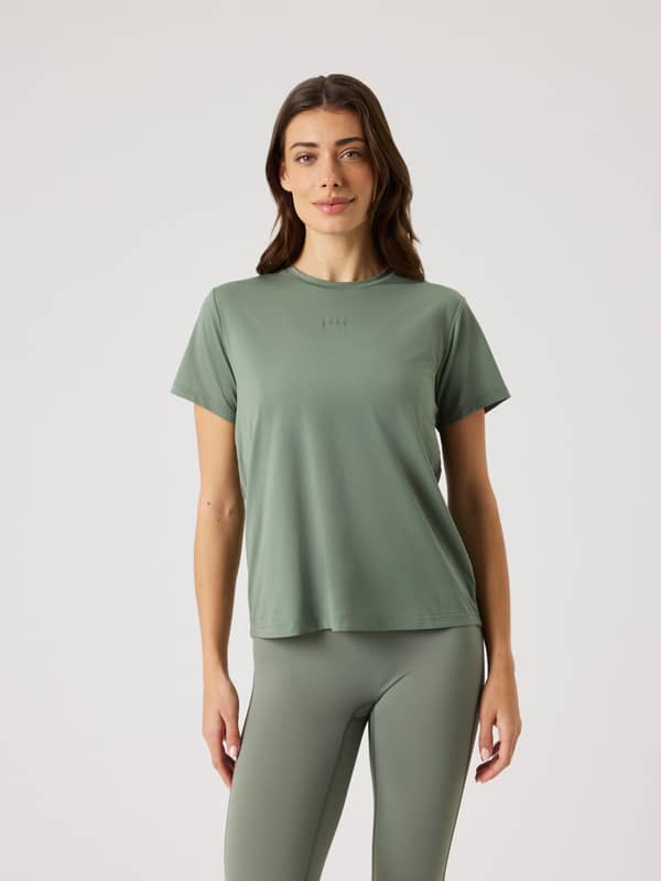 Front view of a model in the Borg Sports T-Shirt in Agave Green (Green), a breathable training top with a flattering fit.