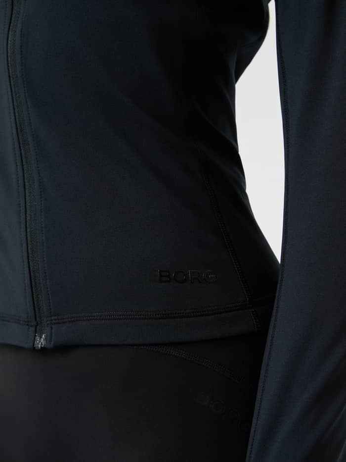 Nahaufnahme des Borg Full Zip Midlayer in Black Beauty (Schwarz) mit schwarzem Logo auf der Brust für Training. - Image 5